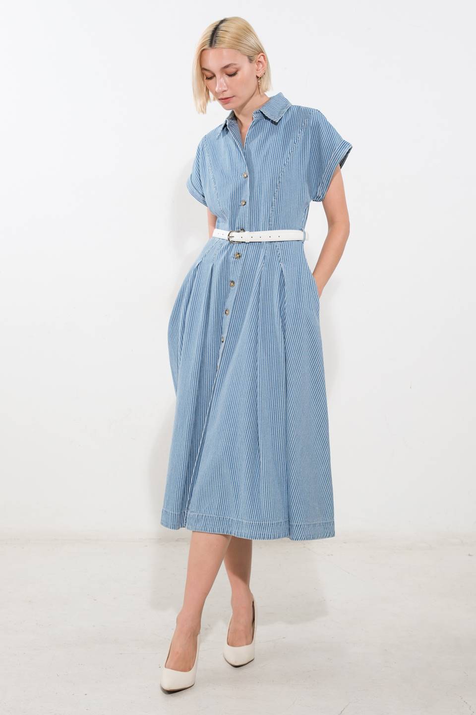 A striped denim midi dress featuring collar, button down, cuffed short sleeve, button down, belt, side pocket and full skirt
Details:
Self : 100% Cotton
Size & Fit
- Model is 5`8" And Wearing Size Small
- Measurements Taken From Size Small
- Approx. Length: 48"