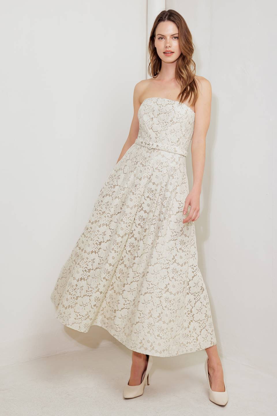 A strapless, woven lace midi dress featuring straight neckline, self belt, full skirt and back zipper closure