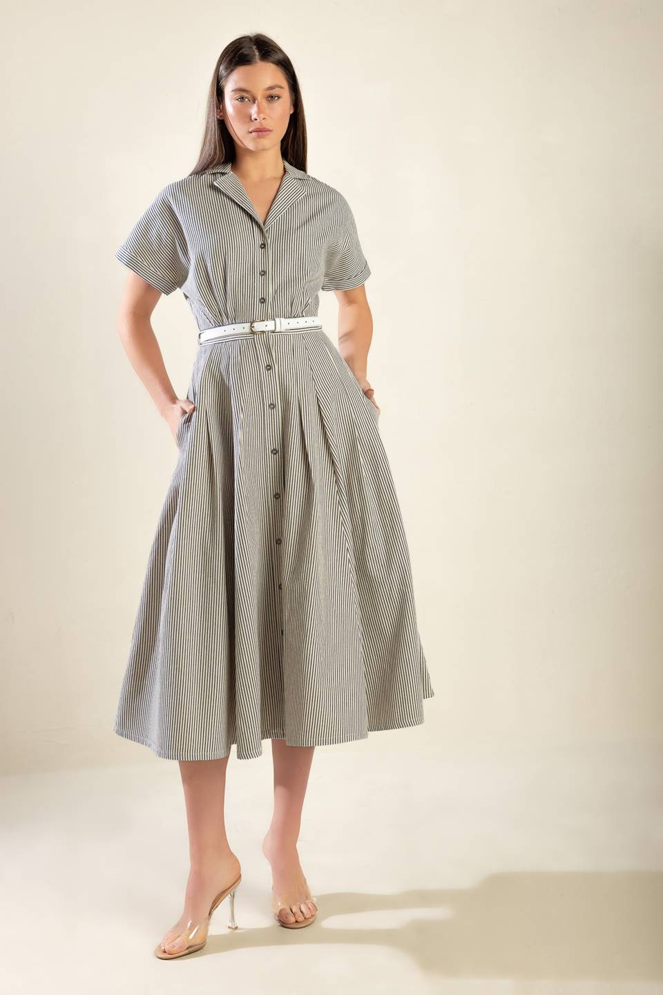 A striped woven midi dress featuring a collar, short sleeve, button down, belt, side pockets, and full skirt
Details:
Self: 70% Cotton 30% Polyester
Size & Fit
- Model is 5`8" And Wearing Size Small
- Measurements Taken From Size Small
- Approx. Length: 53"