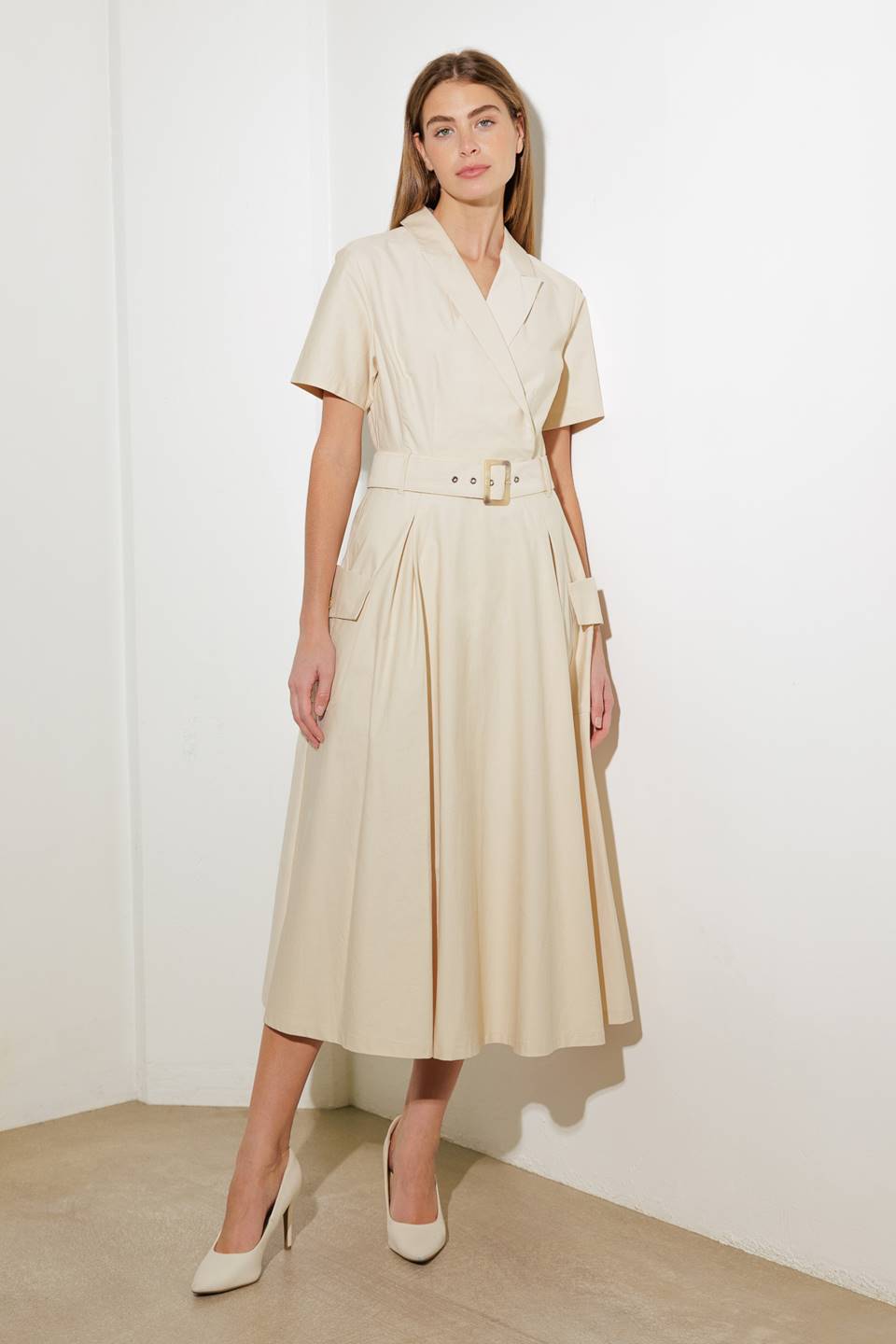 A solid woven midi dress featuring a surplice neckline with collar, short sleeve, self-belt, full skirt with side pocket, and full skirt
Details:
Self: 100% Cotton
Size & Fit
- Model is 5`8" And Wearing Size Small
- Measurements Taken From Size Small
- Approx. Length: 52" FLYING TOMATO