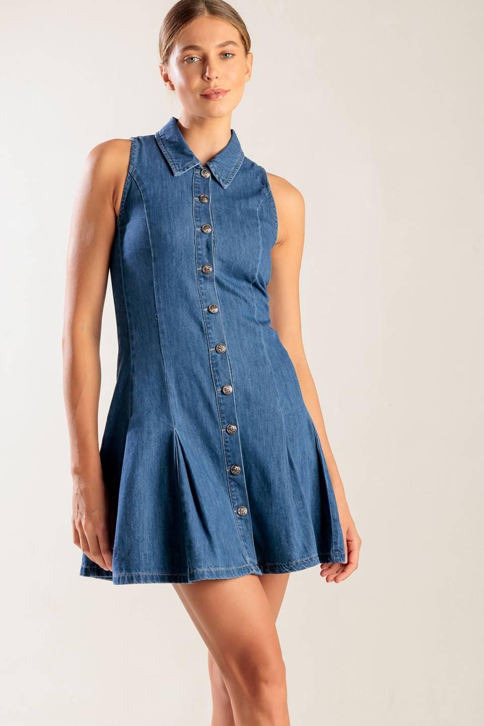 A washed denim mini dress featuring collar, button down, fitted waist and inverted pleats
