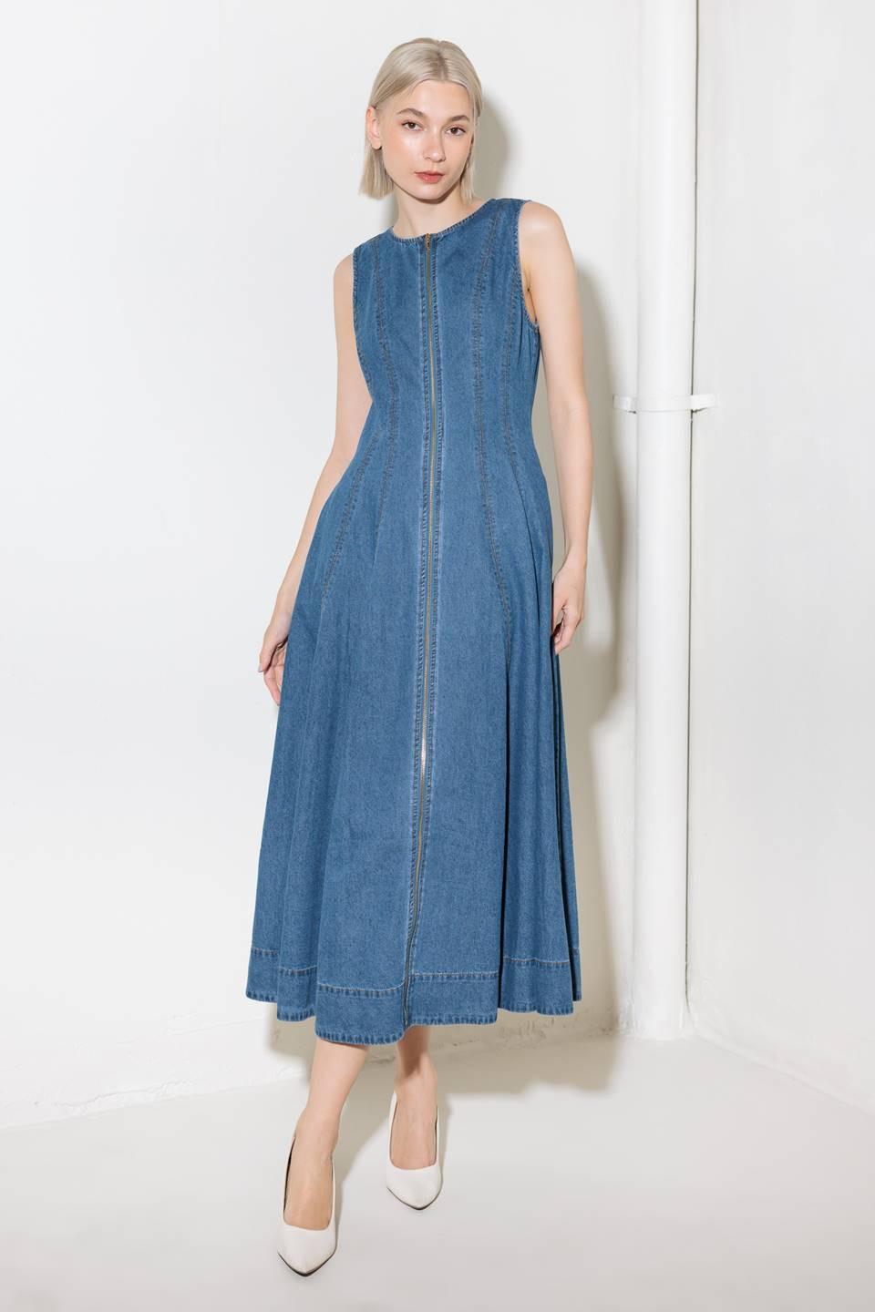 A washed denim midi dress featuring round neckline, sleeveless and front zipper closure.