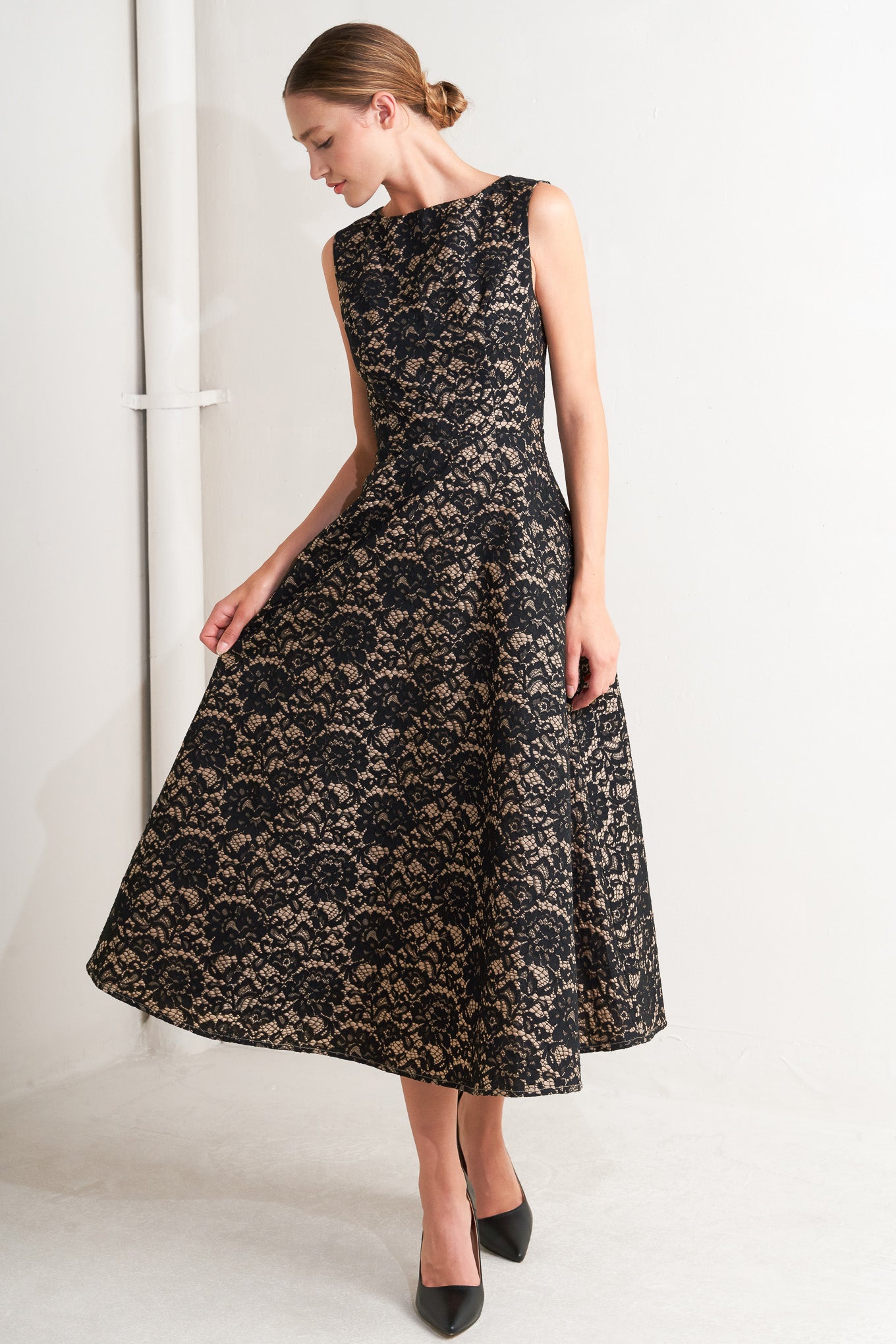 A woven lace midi dress featuring wide neckline, sleeveless, circle skirt and back zipper closure