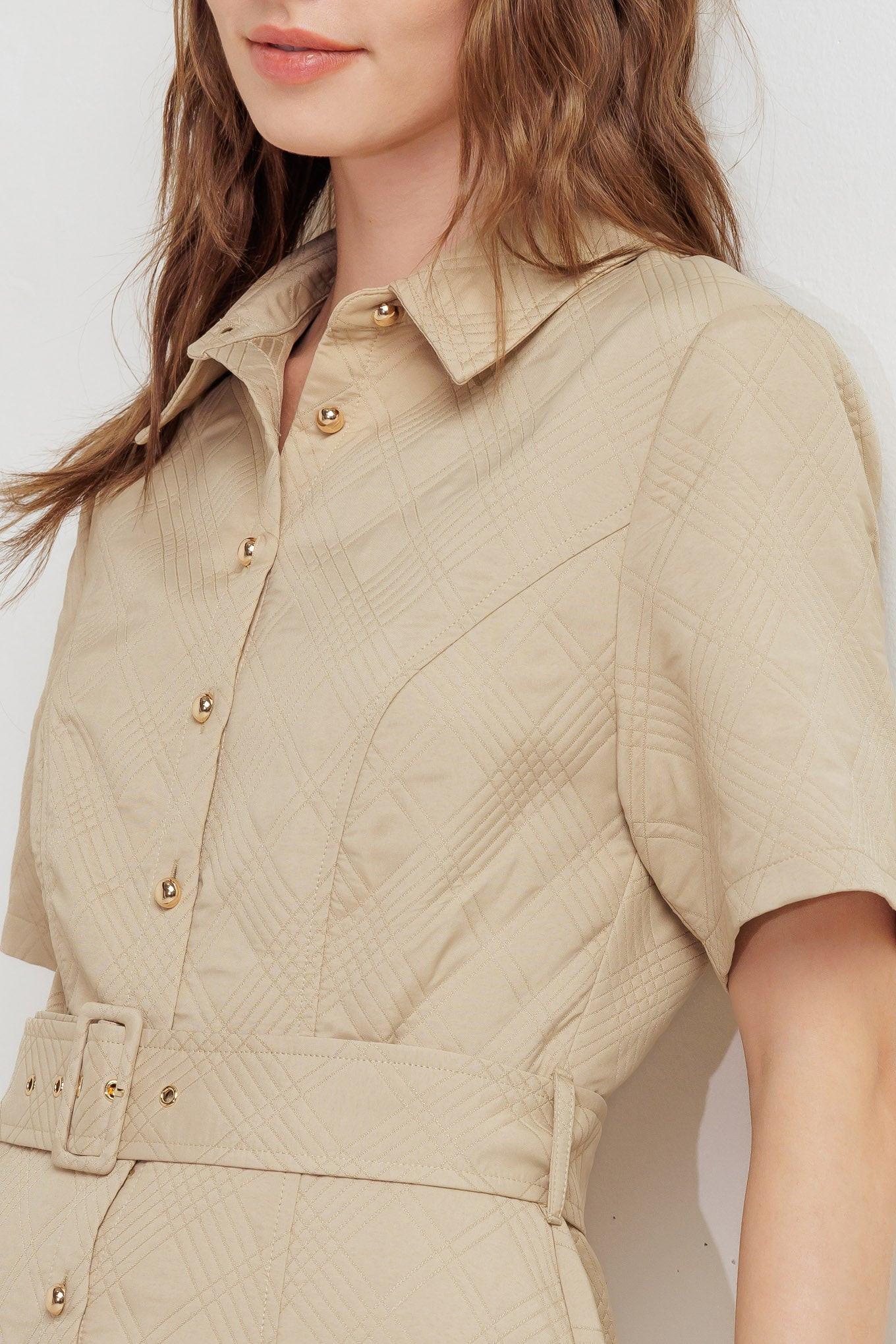 A textured woven midi dress featuring collar, short sleeve, button down, self belt and circle skirt