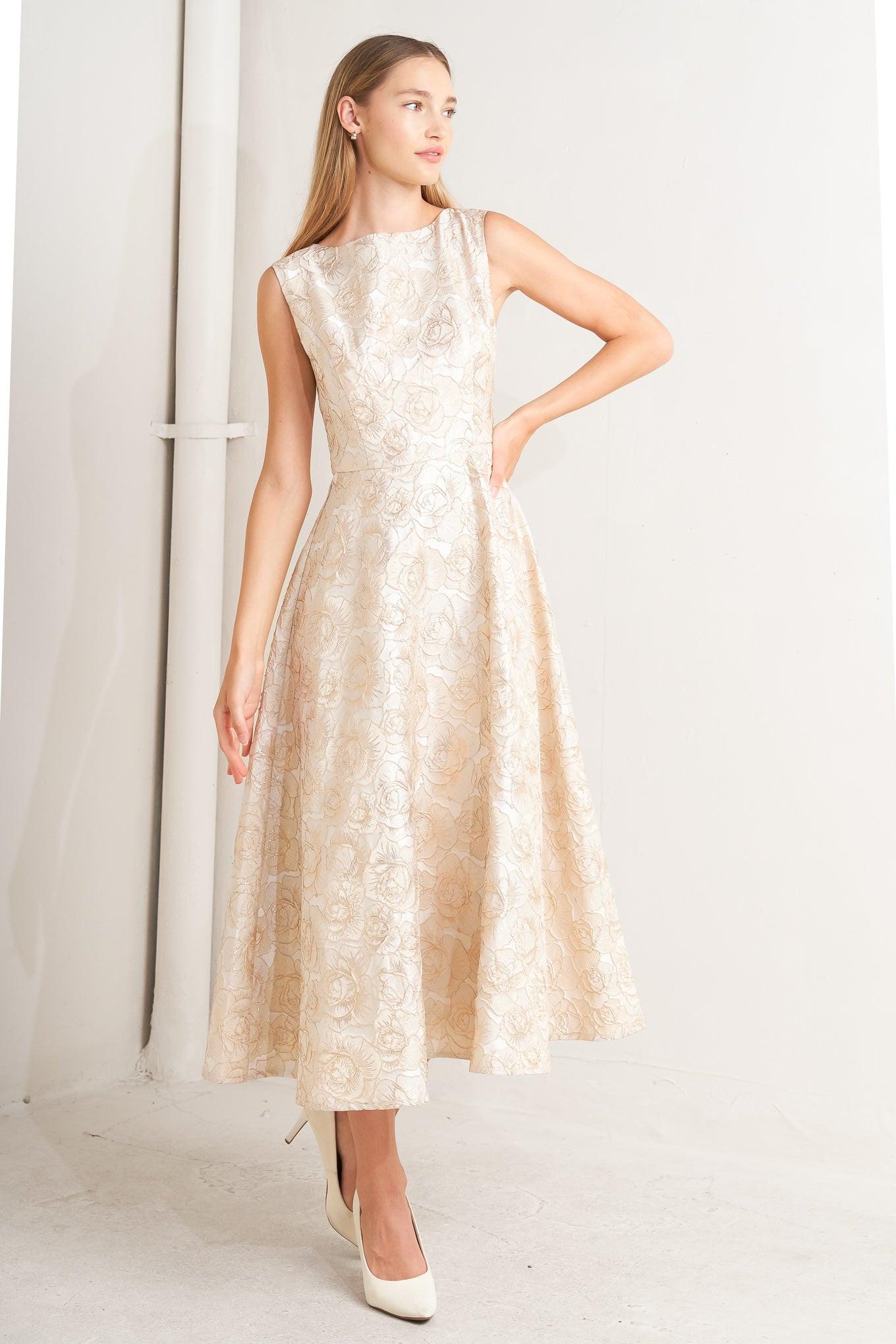 A textured woven midi dress featuring wide neckline, sleeveless, circle skirt and back zipper closure