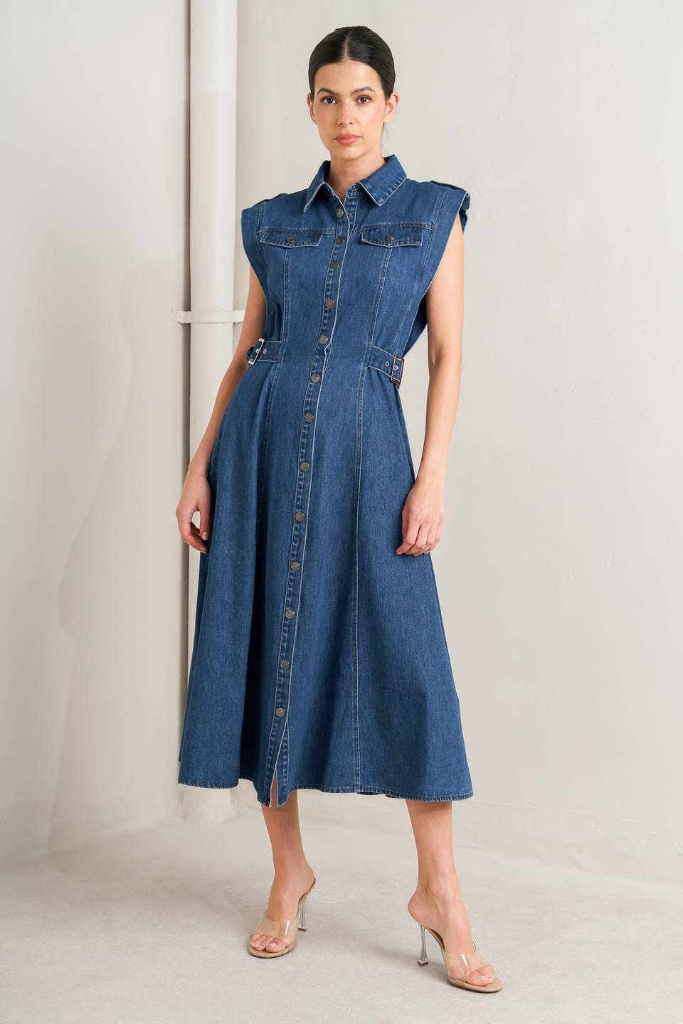 Woman wearing a denim dress against a plain background Flying Tomato