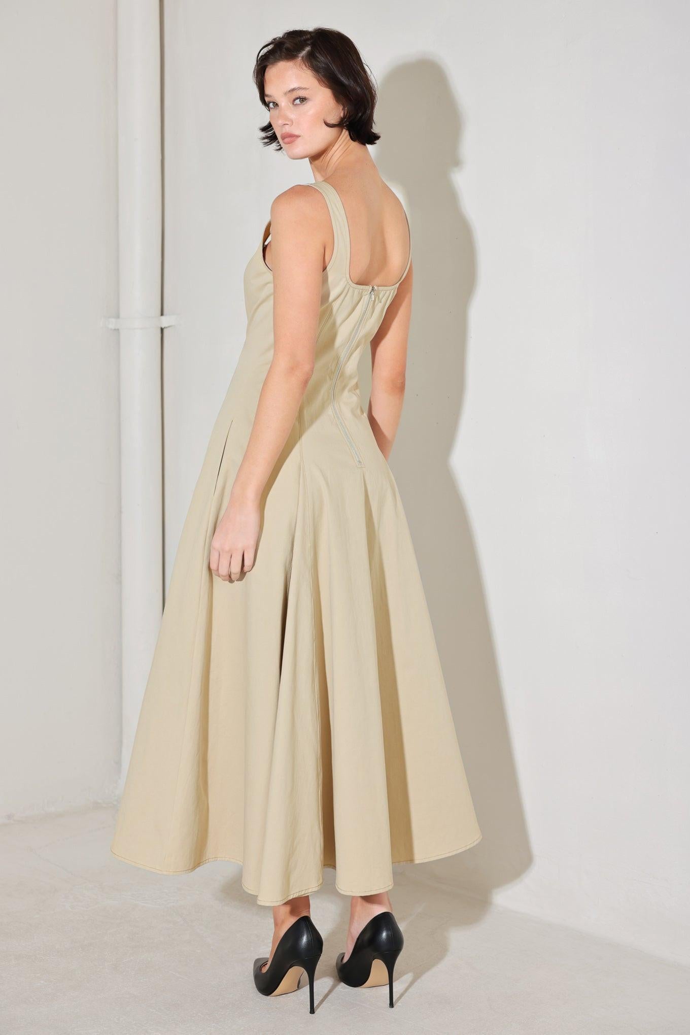 A solid woven midi dress featuring square neckline, sleeveless, circle skirt and back zipper closure
Details:
Self : 100% Cotton
Size & Fit
- Model is 5`8" And Wearing Size Small
- Measurements Taken From Size Small
- Approx. Length: 52"