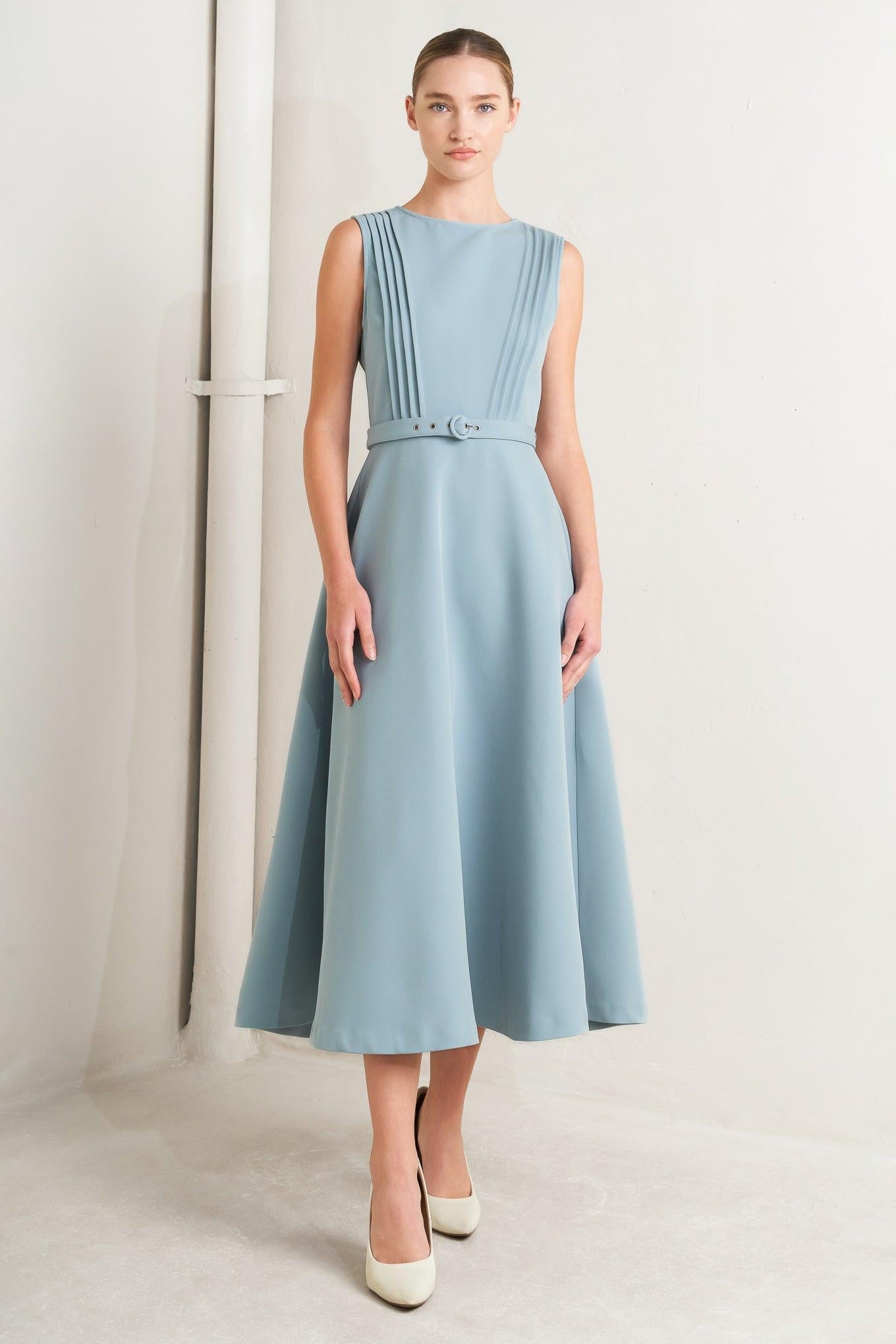 A solid woven midi dress featuring round neckline, sleeveless, pintuck front, self belt, circle skirt and back zipper closure
Details:
Self: 96% Polyester 4% Spandex
Lining: 100% Polyester
Size & Fit
-Model is 5`8" And Wearing Size Small
-Measurements Taken From Size Small
-Approx. Length: 50"