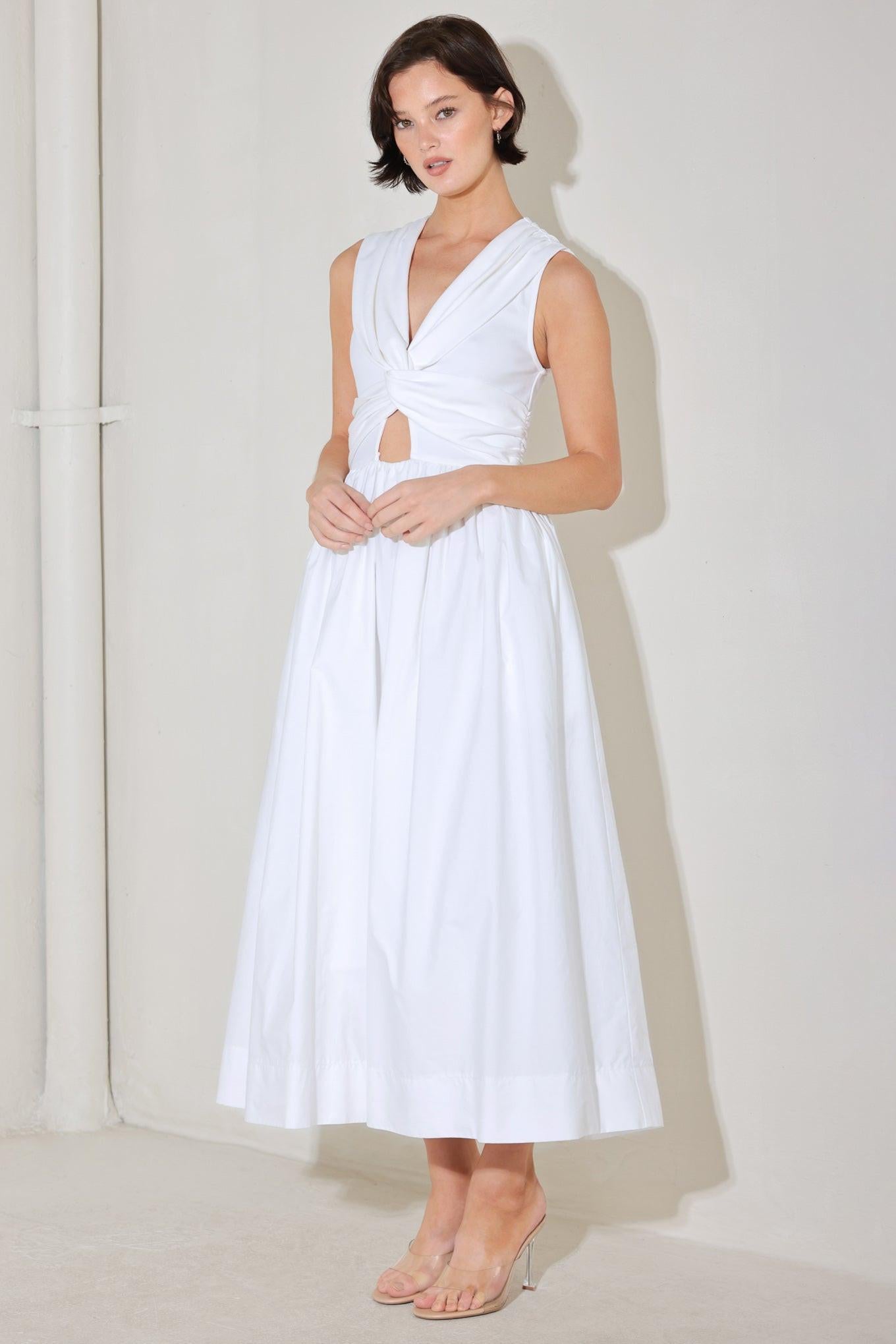 A solid midi dress featuring knit top with V neckline, sleeveless, twist front detail with cut out, full woven skirt and back zipper closure
Details:
Self : 100% Cotton
Contrast : 96% Cotton 4% Spandex
Lining : 100% Polyester
Size & Fit
- Model is 5`8" And Wearing Size Small
- Measurements Taken From Size Small
- Approx. Length: 52"