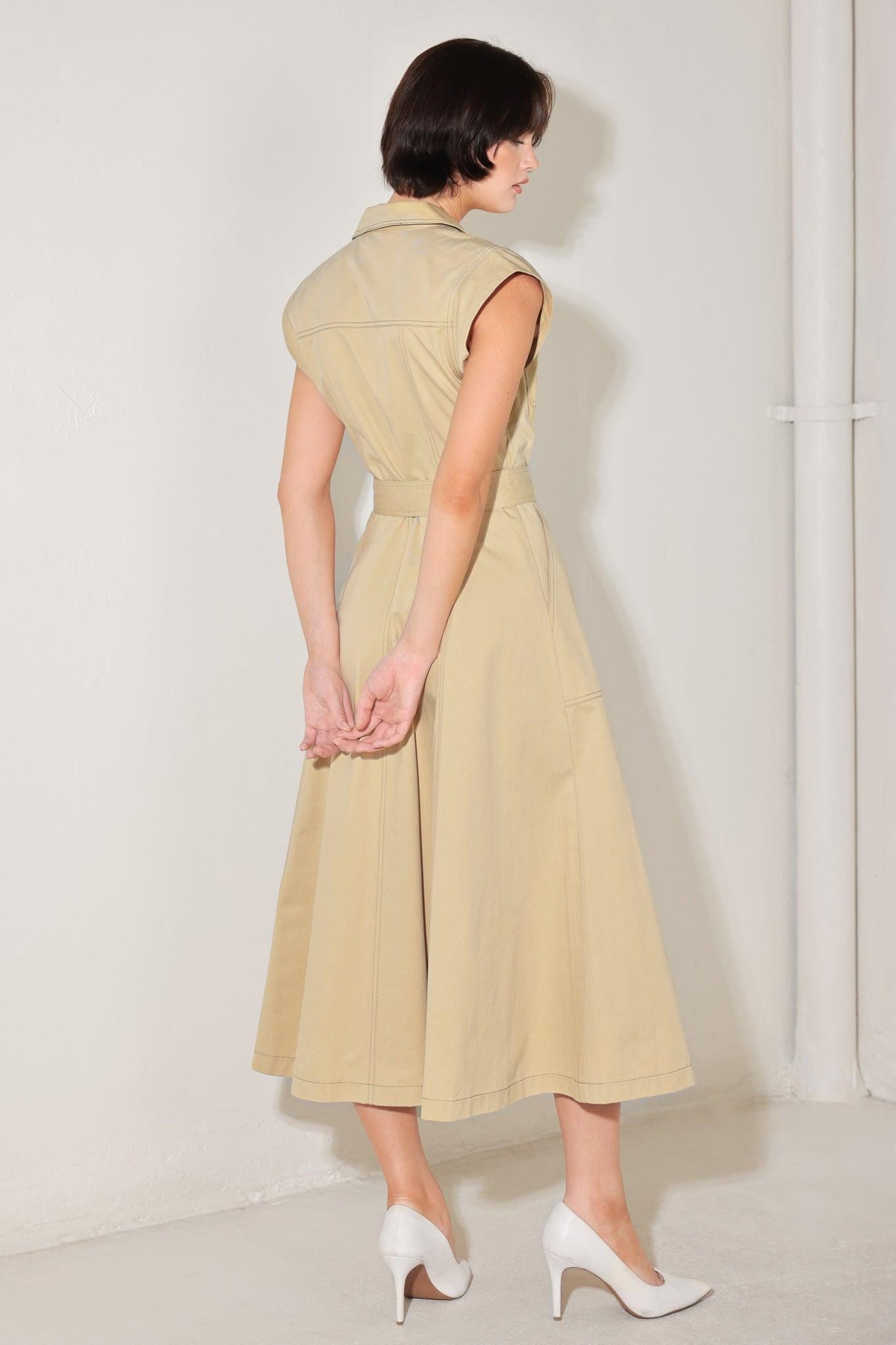 A solid woven midi dress featuring collar, cap sleeve, pockets, button down, self sash tie and circle skirt
Details:
Self : 100% Cotton
Size & Fit
- Model is 5`8" And Wearing Size Small
- Measurements Taken From Size Small
- Approx. Length: 49"