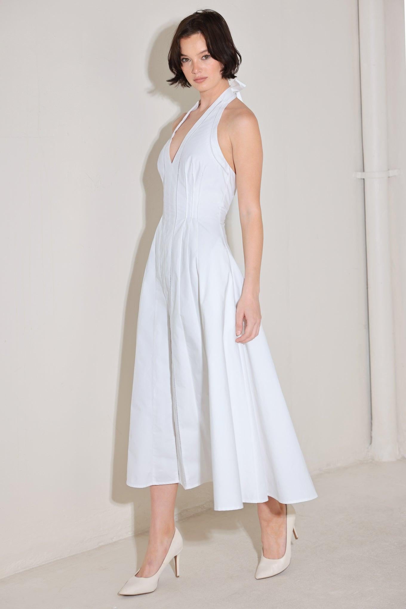 A solid woven midi dress featuring halter neckline with back neck tie, corset waist, lace trim inset, circle skirt and back zipper closure
Details:
Self : 100% Cotton
Lining : 90% Polyester 10% Cotton
Size & Fit
- Model is 5`8" And Wearing Size Small
- Measurements Taken From Size Small
- Approx. Length: 52"