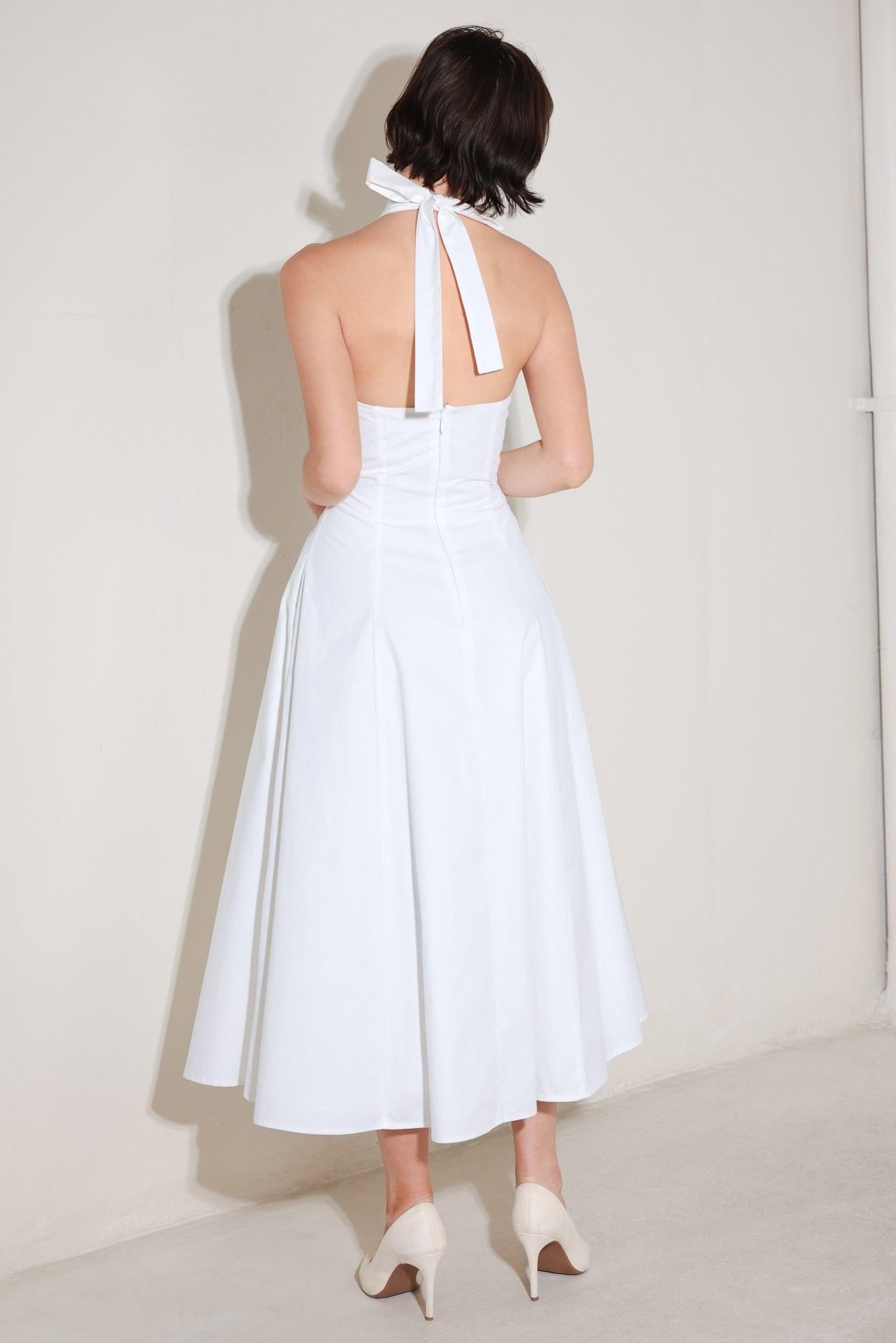 A solid woven midi dress featuring halter neckline with back neck tie, corset waist, lace trim inset, circle skirt and back zipper closure
Details:
Self : 100% Cotton
Lining : 90% Polyester 10% Cotton
Size & Fit
- Model is 5`8" And Wearing Size Small
- Measurements Taken From Size Small
- Approx. Length: 52"