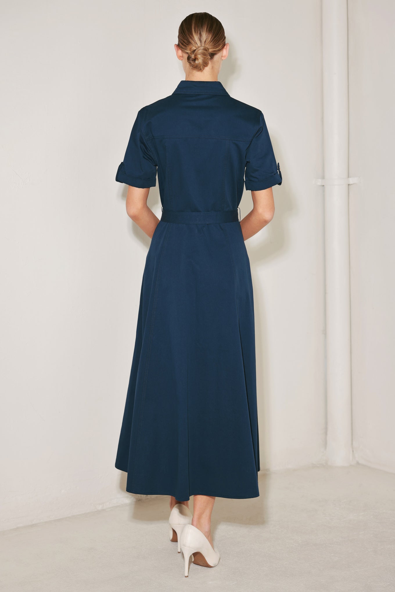 A solid woven midi dress featuring collar, cuffed short sleeve, front button down, self belt and circle skirt
Details:
Self : 100% Cotton
Size & Fit
- Model is 5`8" And Wearing Size Small
- Measurements Taken From Size Small
- Approx. Length: 50"