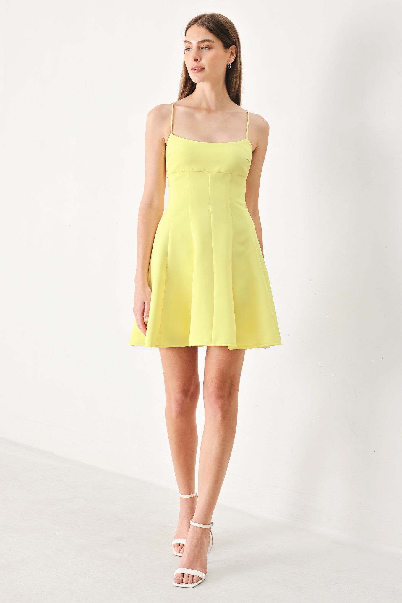 Woman wearing a yellow cami dress with strap, circle skirt and back zipper | FREEMARKET | Flying Tomato