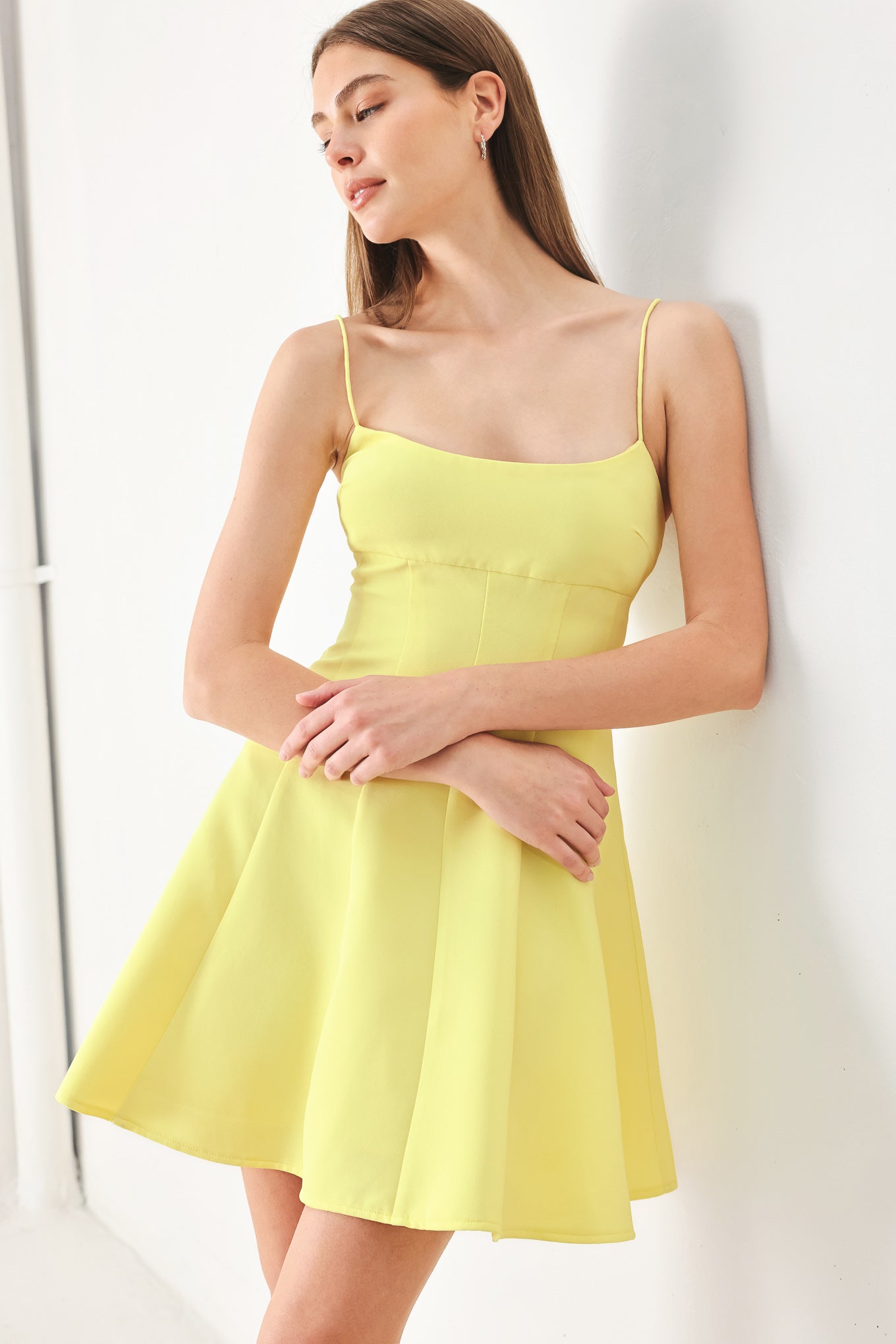 Woman wearing a yellow cami dress with strap, circle skirt and back zipper | FREEMARKET | Flying Tomato