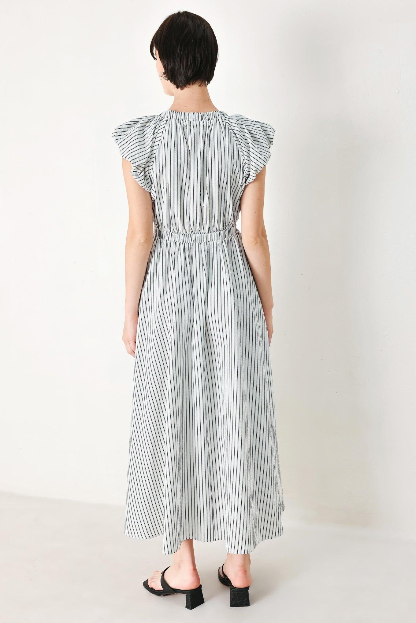 A striped woven midi dress featuring V neckline, short balloon sleeves, front tie, elastic at empire and full skirt