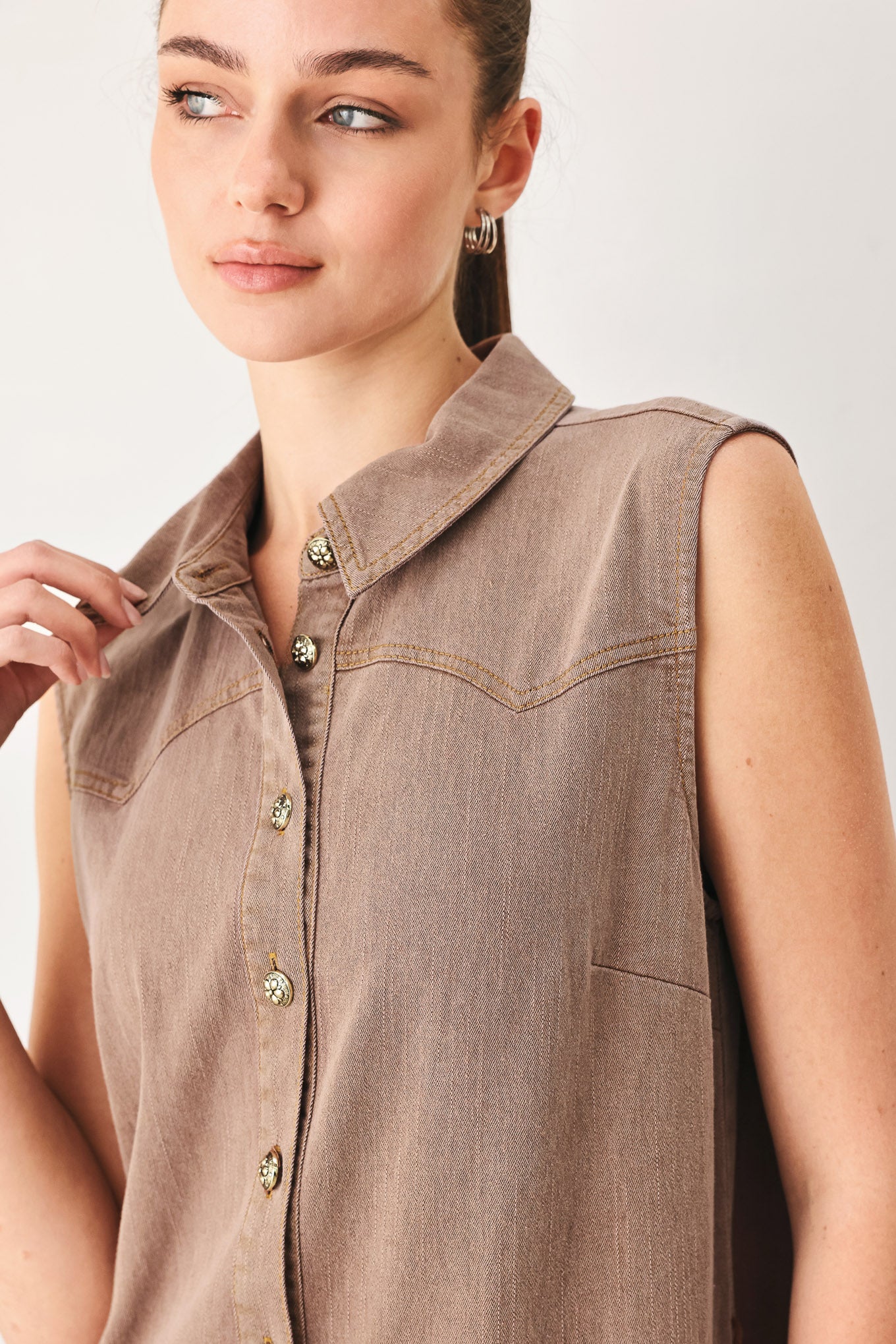 Woman wearing a sleeveless brown tiered midi dress featuring collar, button down, self tie and tier skirt | FREEMARKET