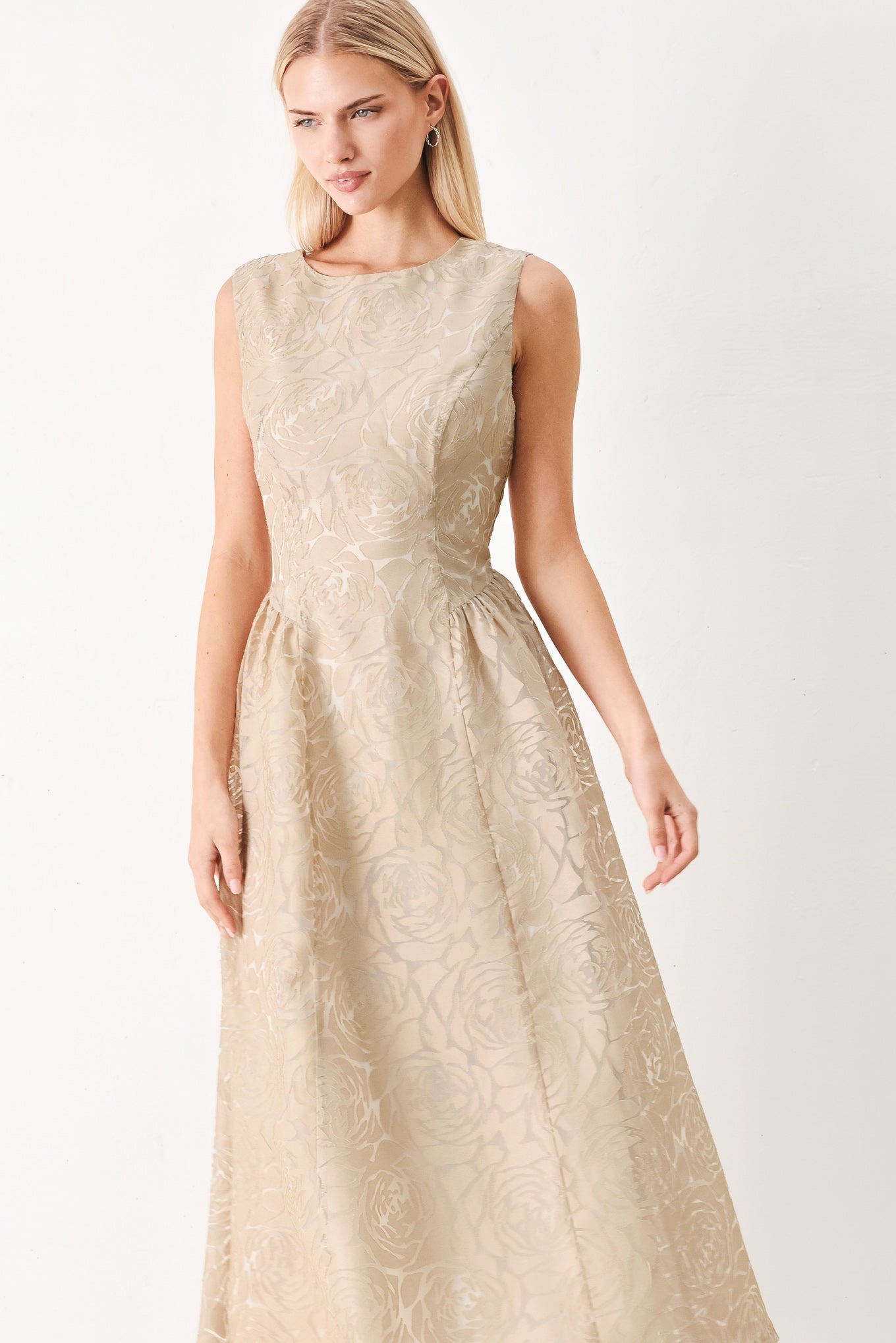 Woman wearing a beige lace burnout organza midi dress featuring round neckline, sleeveless, side shirring detail and back zipper closure | FREEMARKET