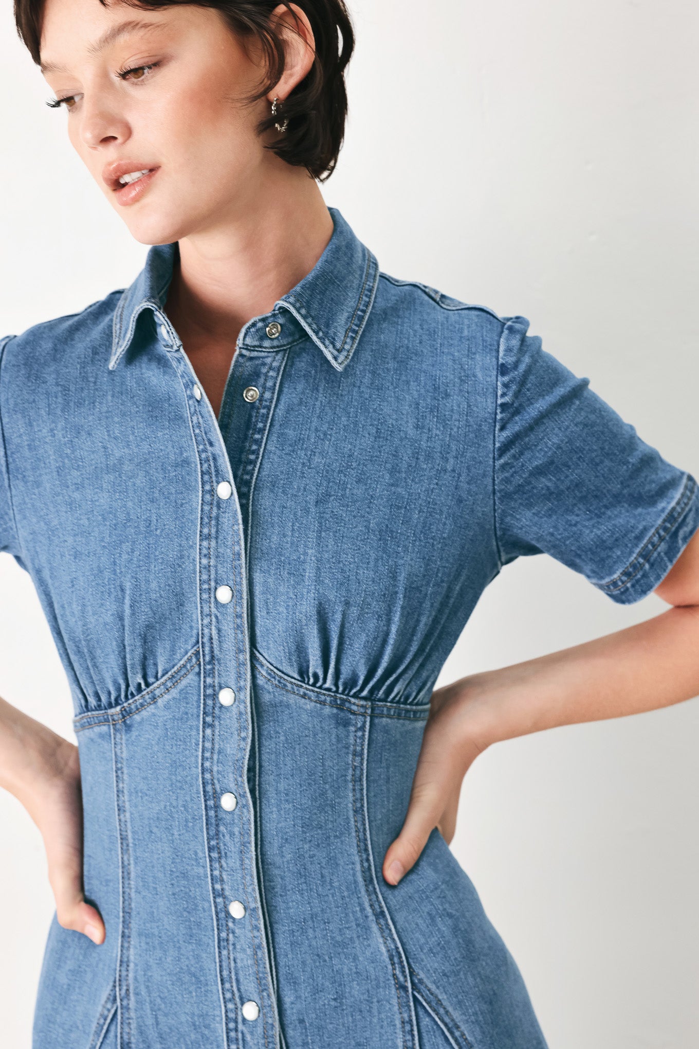 Woman wearing a blue denim midi shirt dress with front closure and circle skirt | FREEMARKET