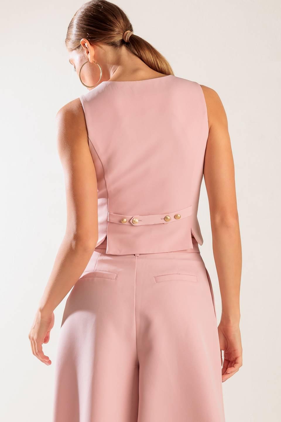 A solid woven vest featuring V neckline, sleeveless and button down.