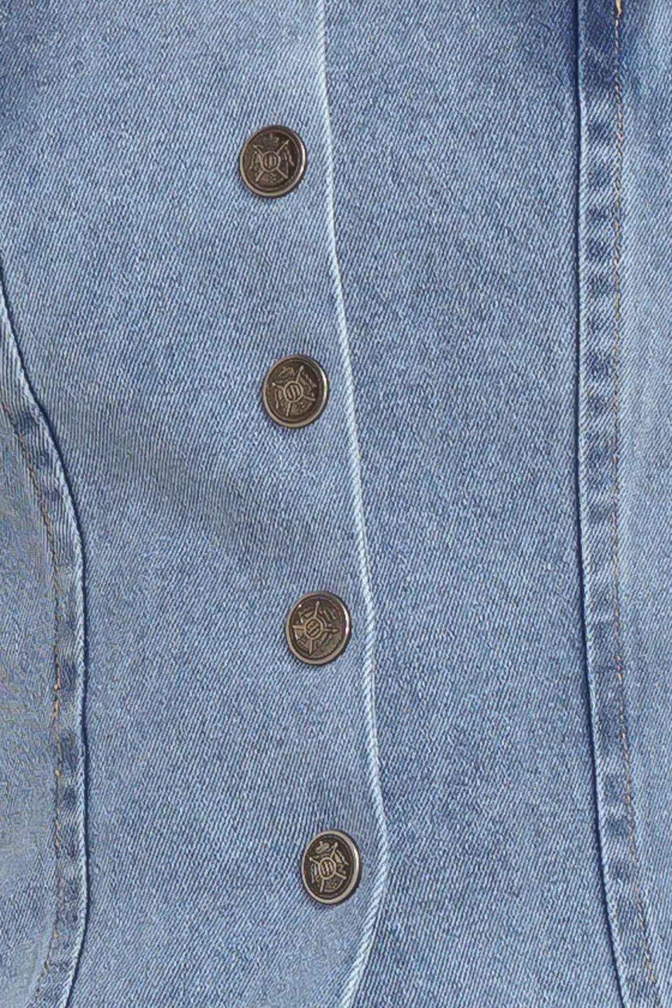 A strapless, washed denim top featuring a front button down