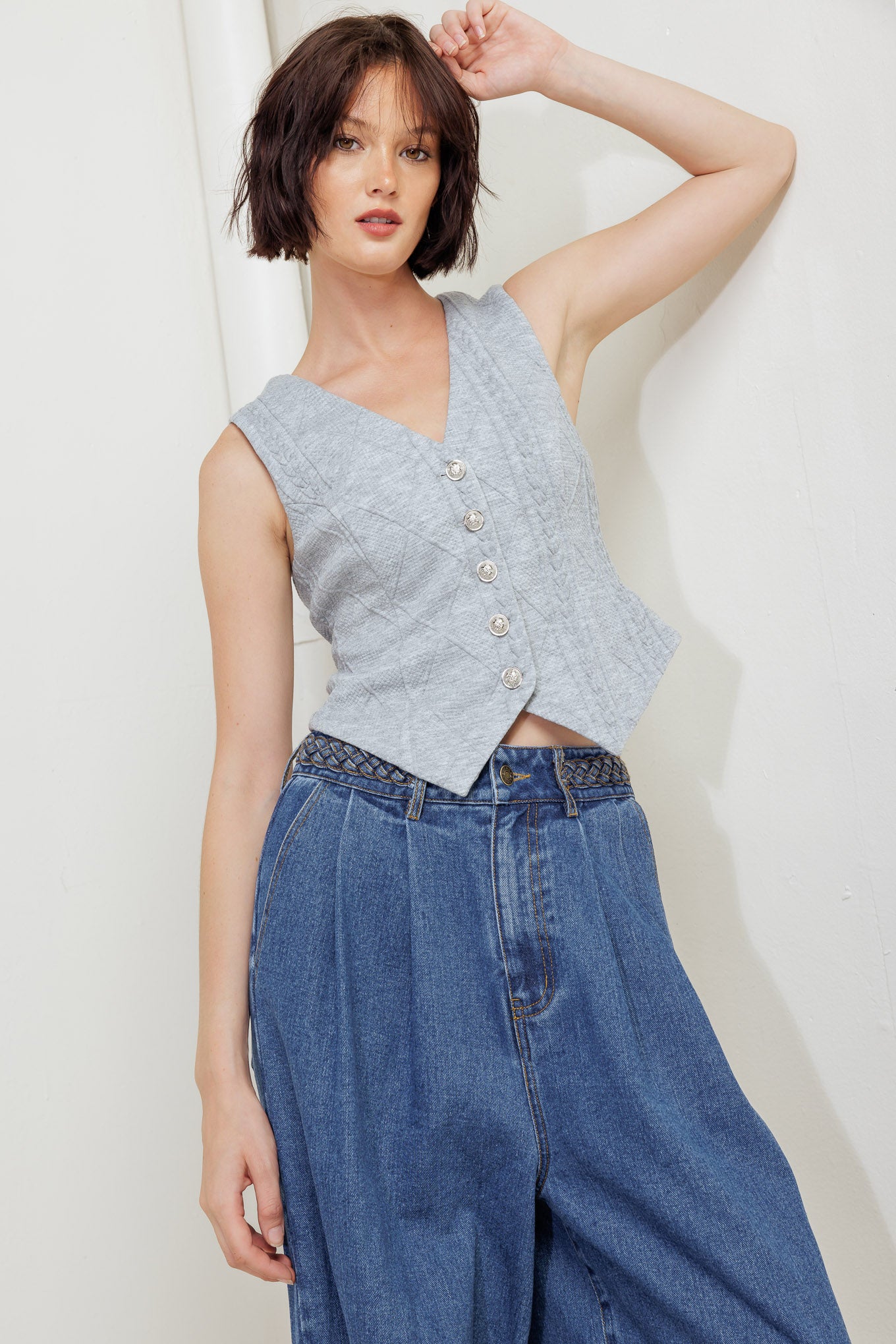A knit cut/sew vest with front closure.
