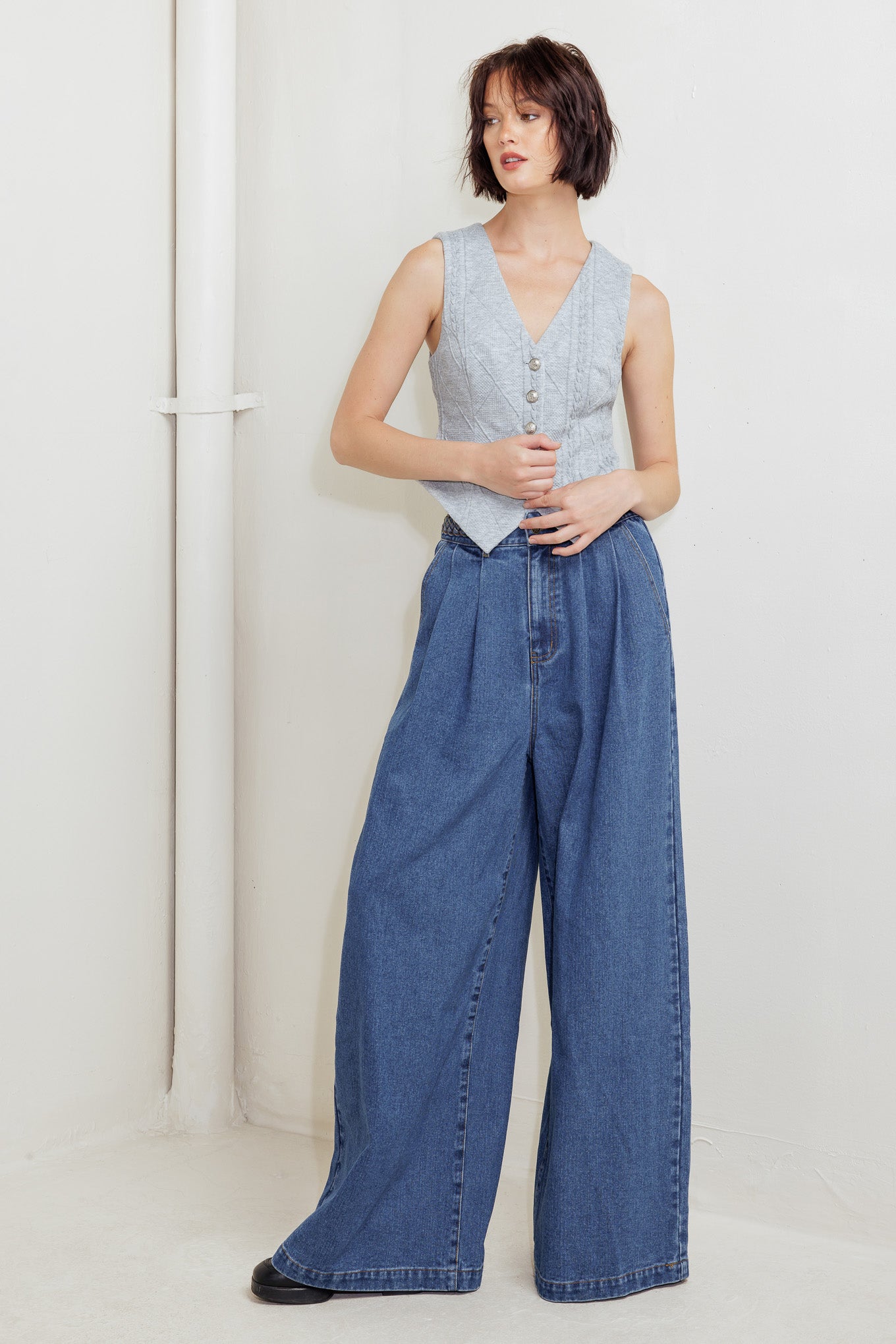 A knit cut/sew vest with front closure.