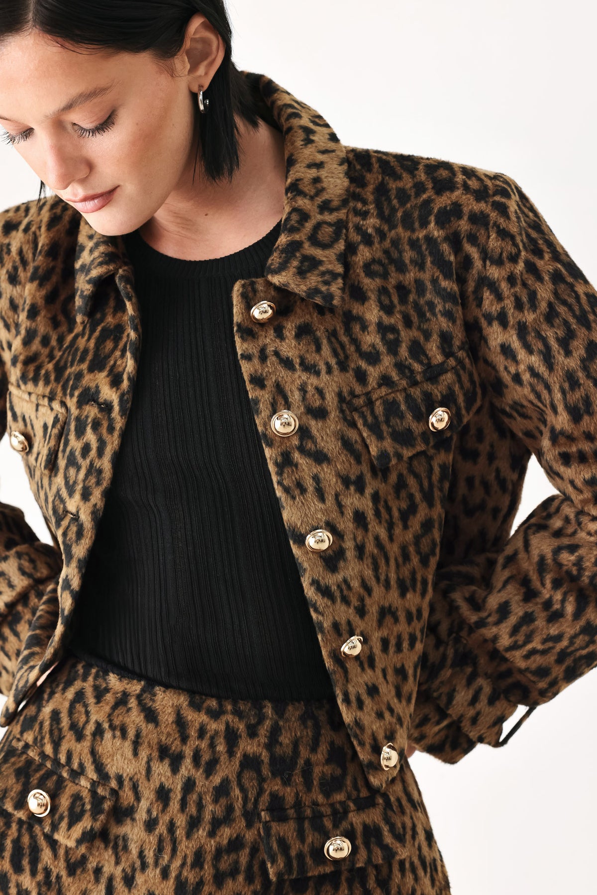 A model wearing a brown and black leopard print jacket with gold-tone buttons | FREEMARKET