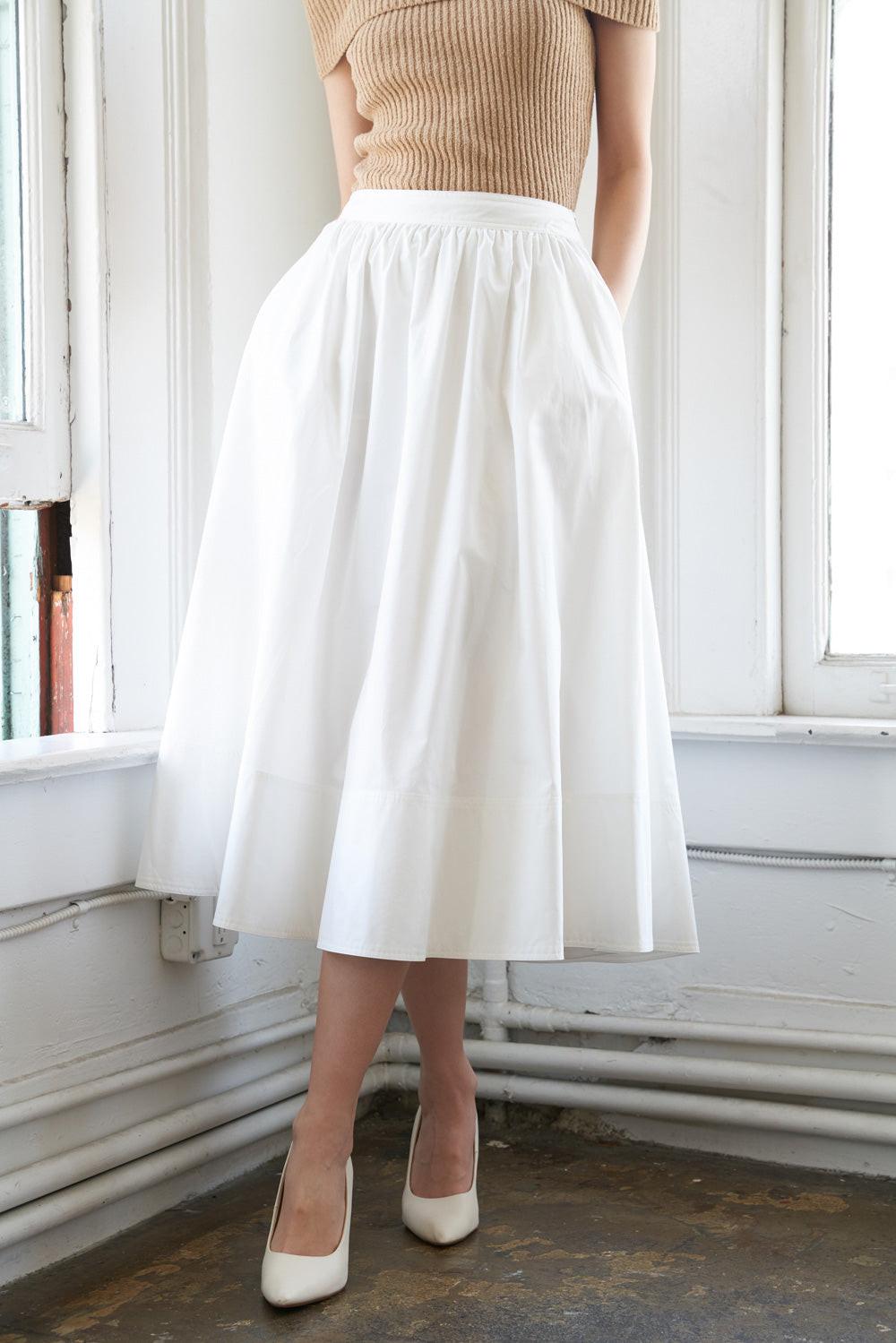 HOLDING ON TIGHT POPLIN MIDI SKIRT.