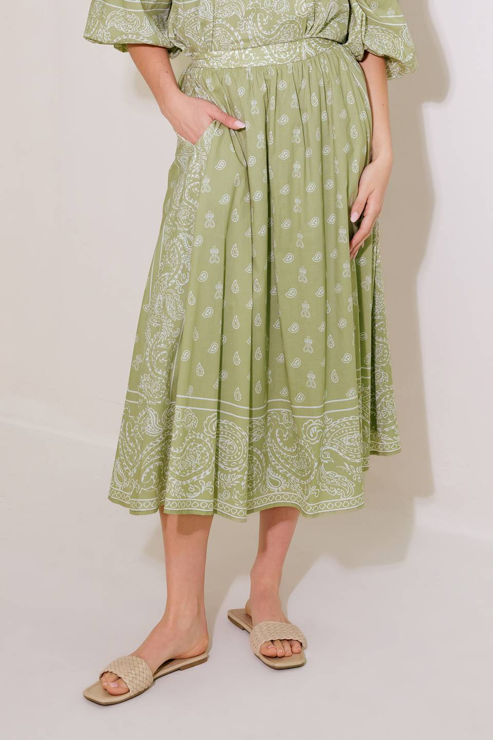 A printed woven full midi skirt with side zipper closure.