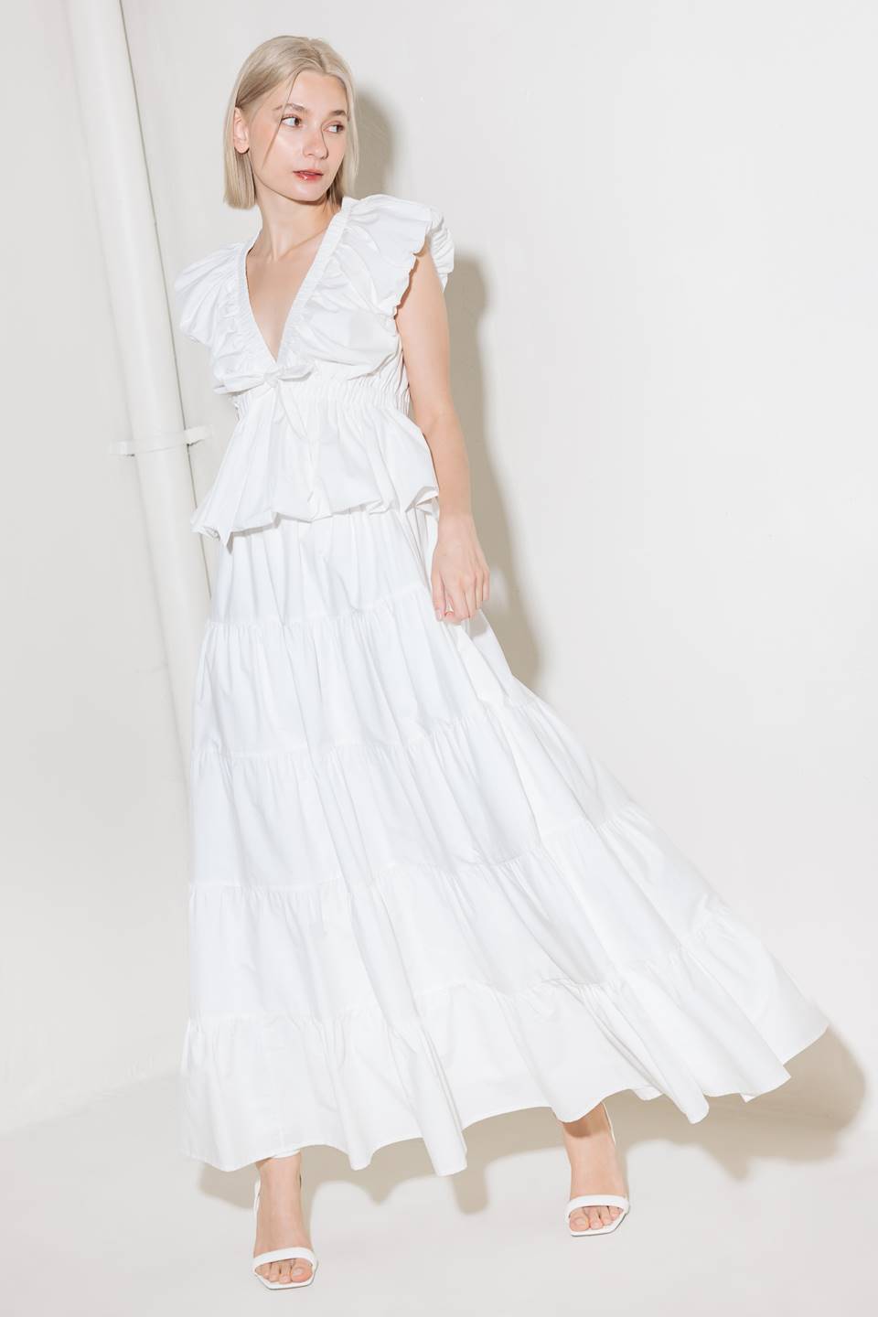 A woven maxi skirt featuring an elasticized waist and tiers.
