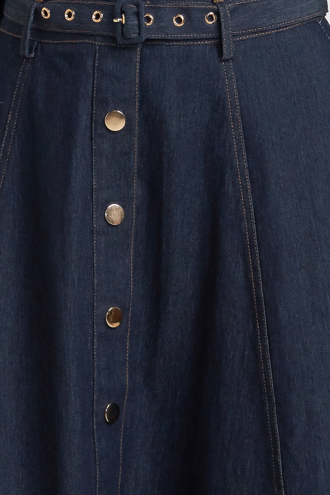 A denim circle skirt featuring self belt, front button down and wide hemline