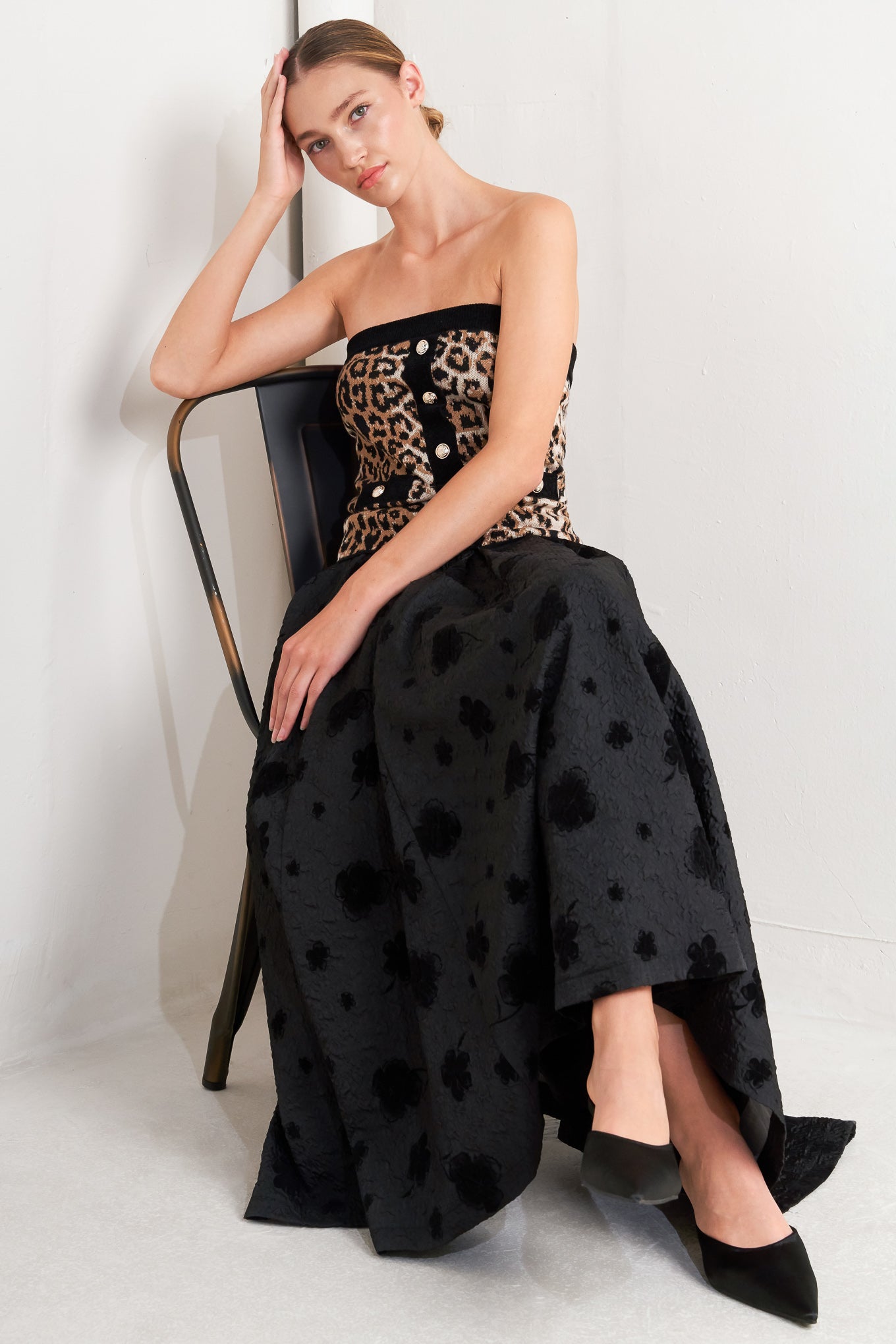 A textured woven full midi skirt with self belt and back zipper closure.