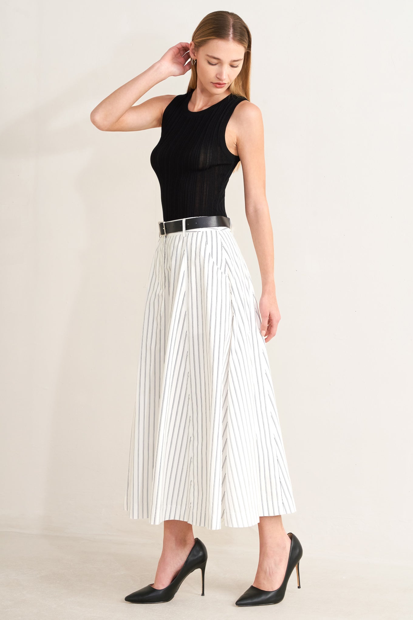 A striped woven midi circle skirt with contrasting belt and side pockets