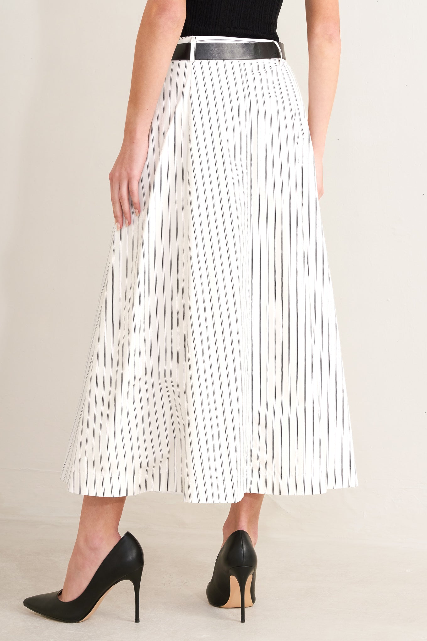 A striped woven midi circle skirt with contrasting belt and side pockets