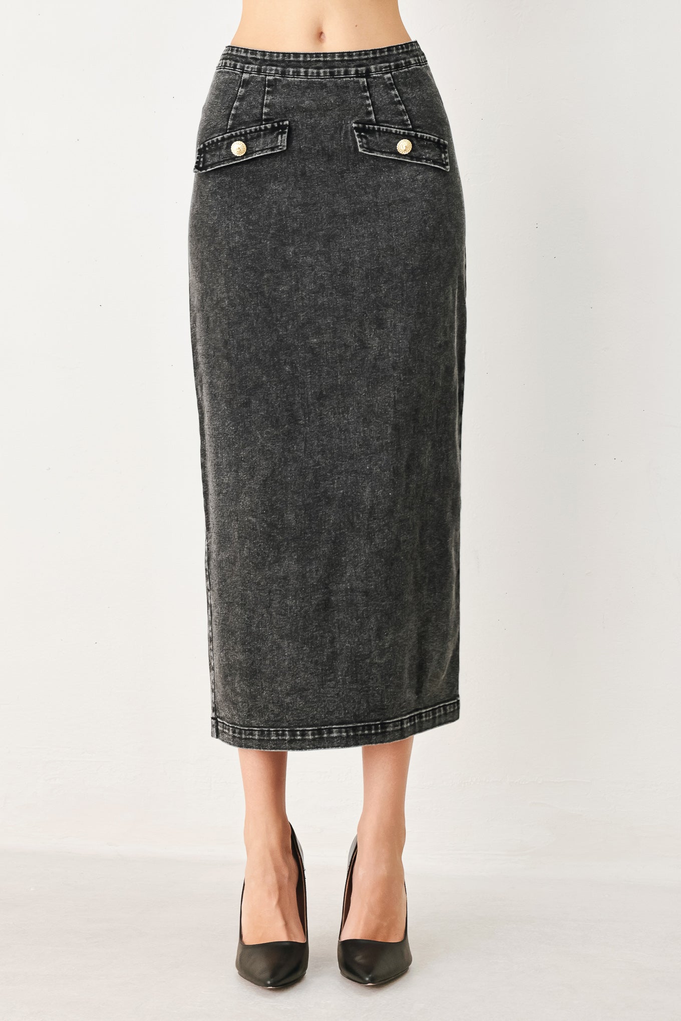 A washed denim midi pencil skirt with back slit and zipper closure. Matching top FT2063