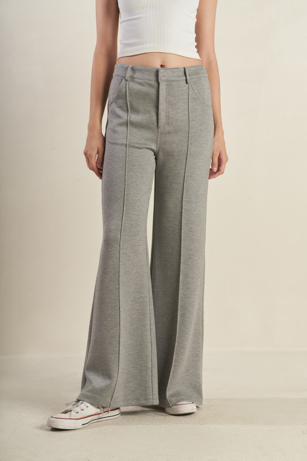 A solid woven pant with front closure, pockets and flare leg. Matching top FT1351
Details:
Self : 46% Rayon 49% Polyester 5% Spandex 
Size & Fit
- Model is 5`8" And Wearing Size Small
- Measurements Taken From Size Small
- Approx. Length: 42" Inseam- 30"
