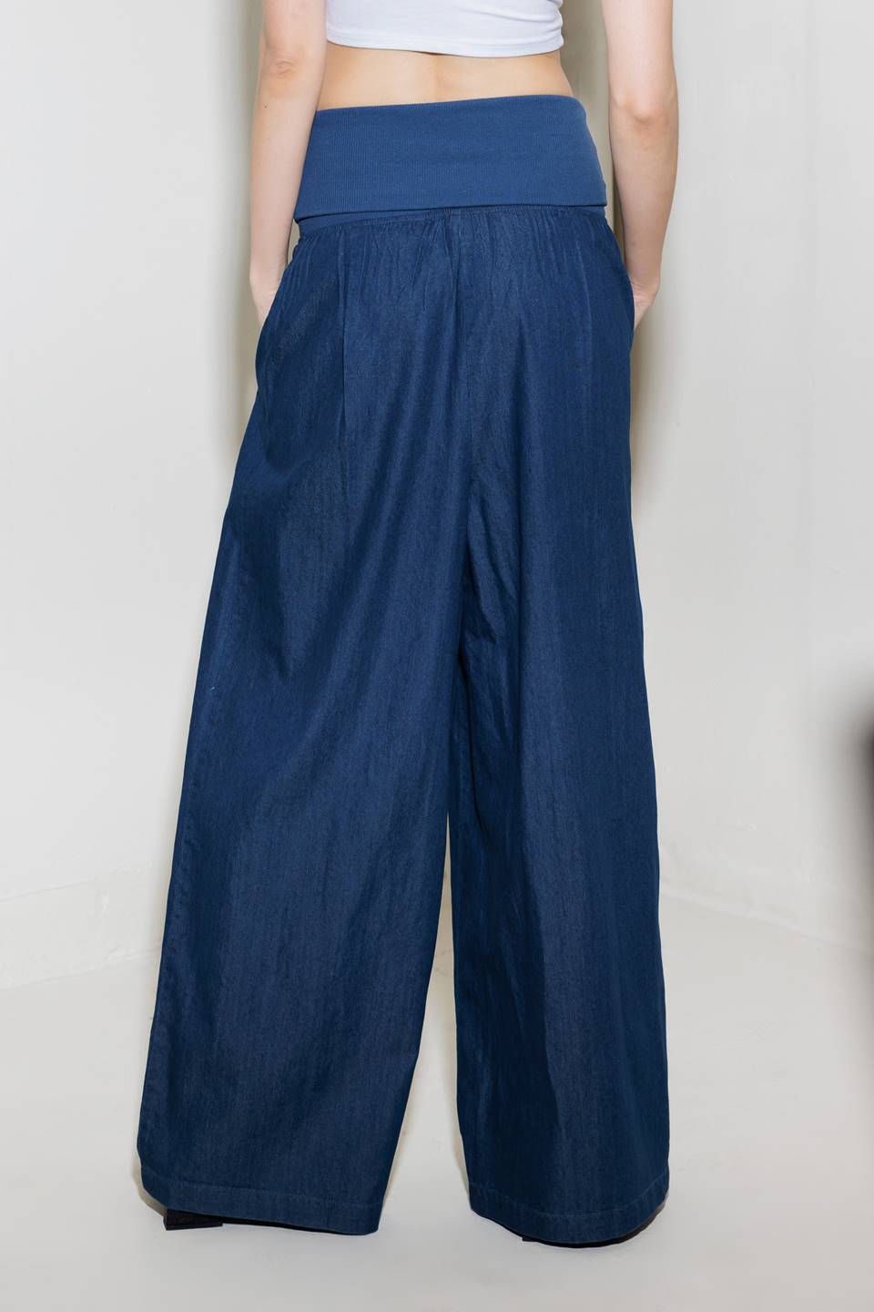 A chambray pant/jumpsuit 2fer with ribbed band and side pocket.