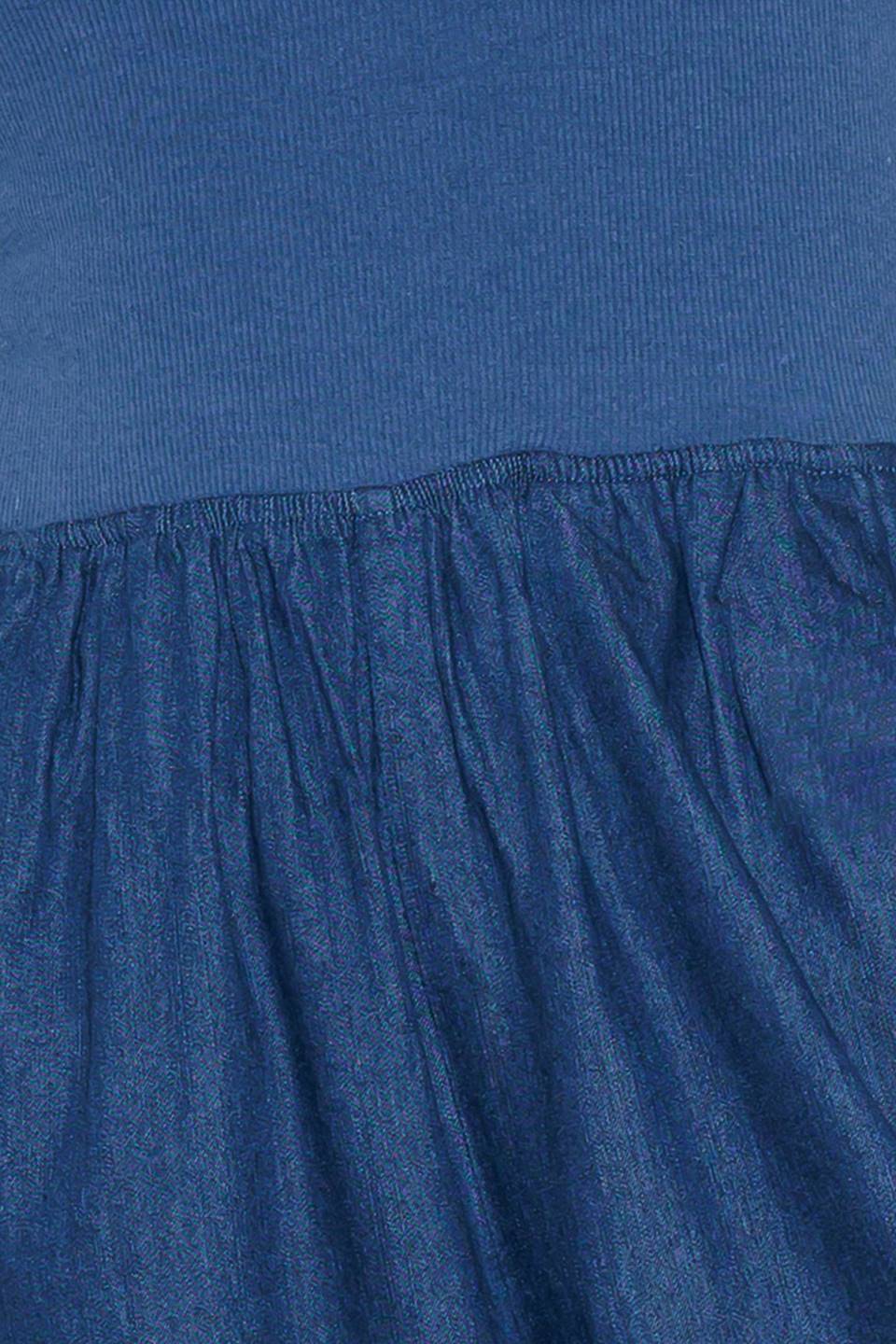 A chambray pant/jumpsuit 2fer with ribbed band and side pocket.