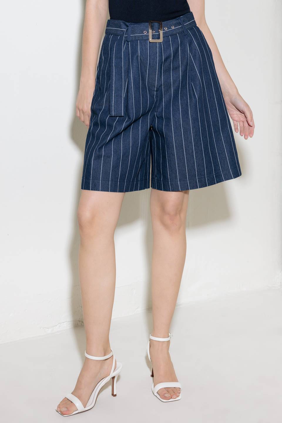 A striped woven bermuda short featuring self belt and side pocket.