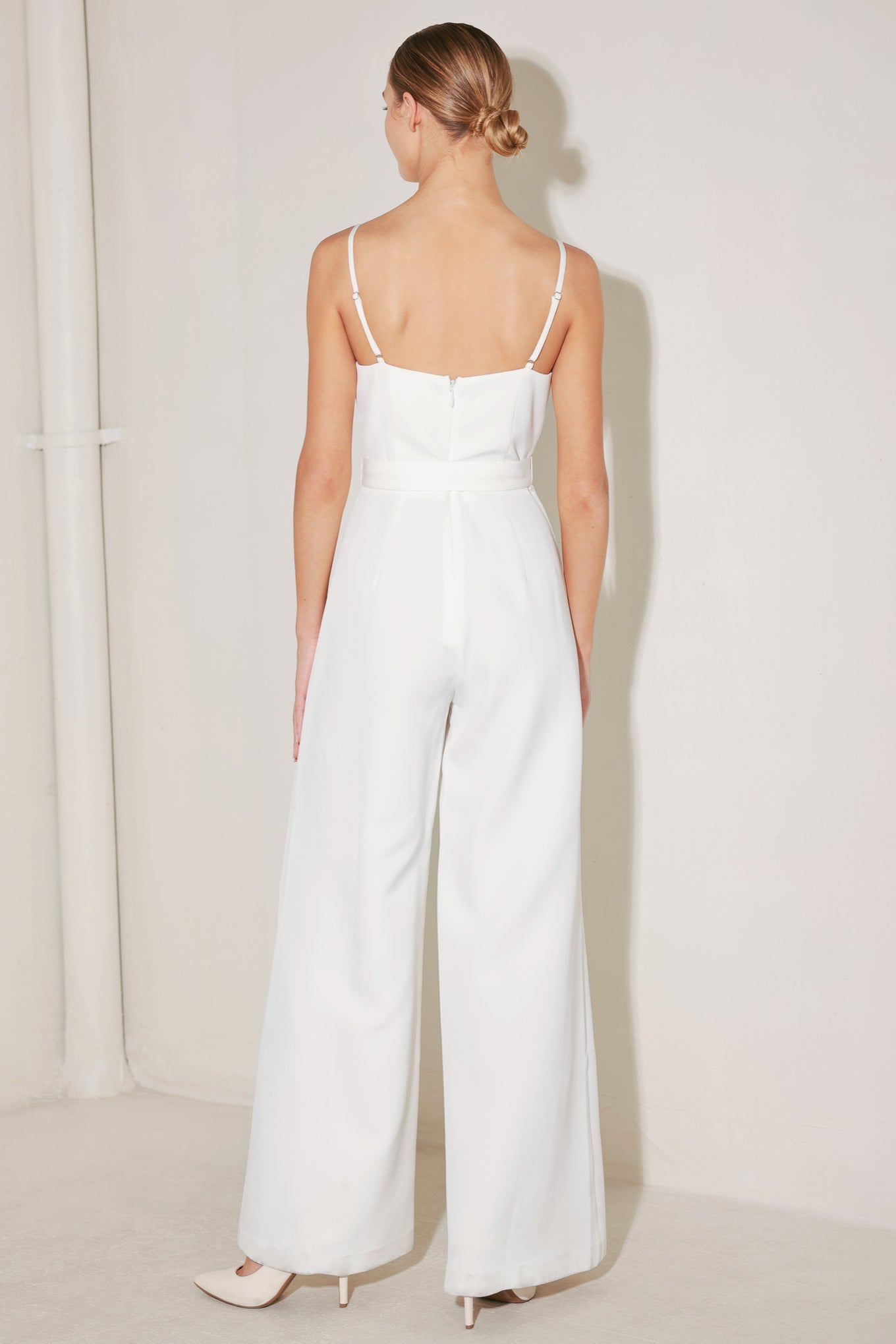 A solid woven jumpsuit featuring straight neckline with fold over detail, straps, self belt, wide leg and back zipper closure
Details:
Self : 95% Polyester 5% Spandex
Lining : 100% Polyester
Size & Fit
- Model is 5`8" And Wearing Size Small
- Measurements Taken From Size Small
- Approx. Length: 58"