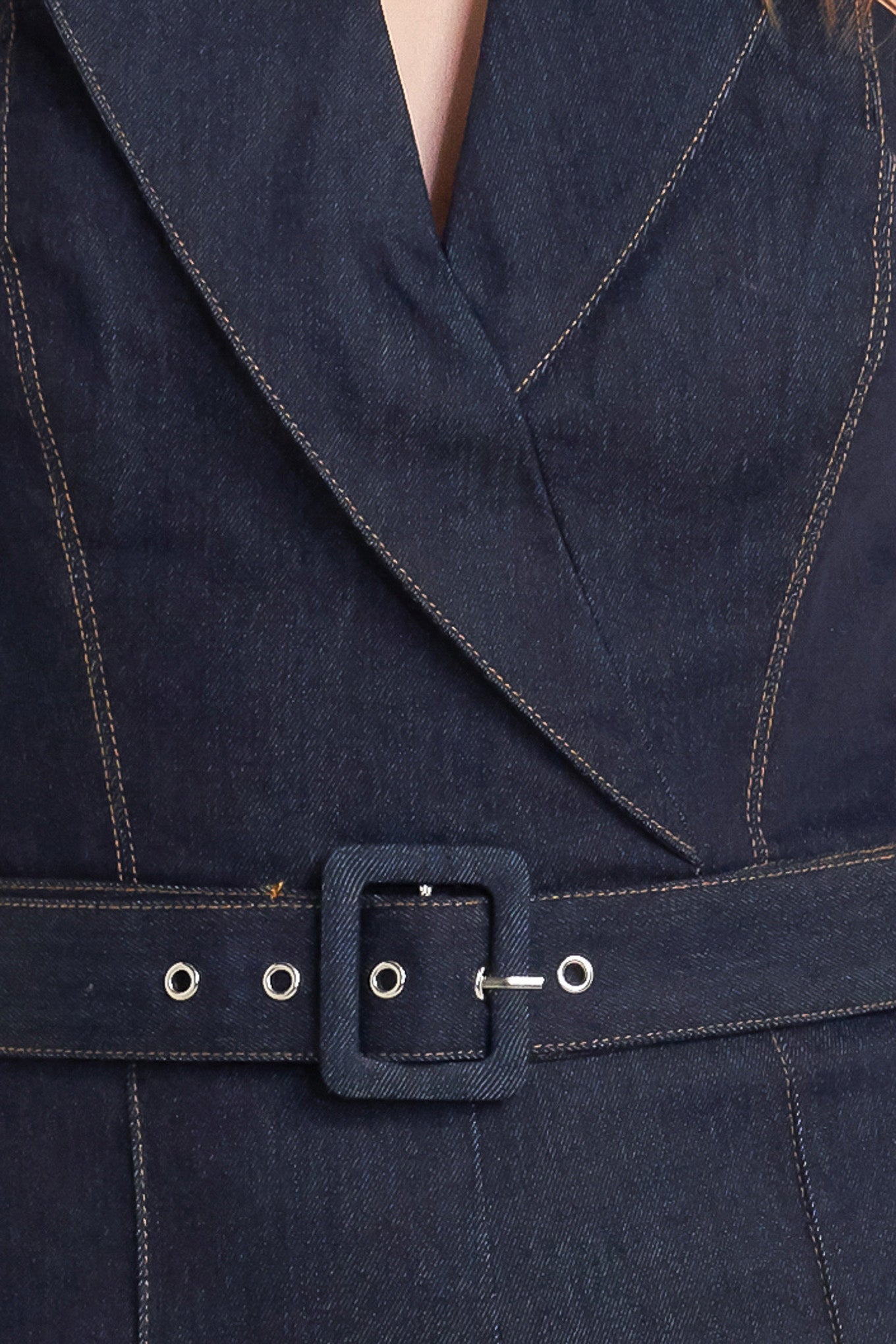 A denim jumpsuit featuring strapless, front fold over detail, self belt and wide leg
