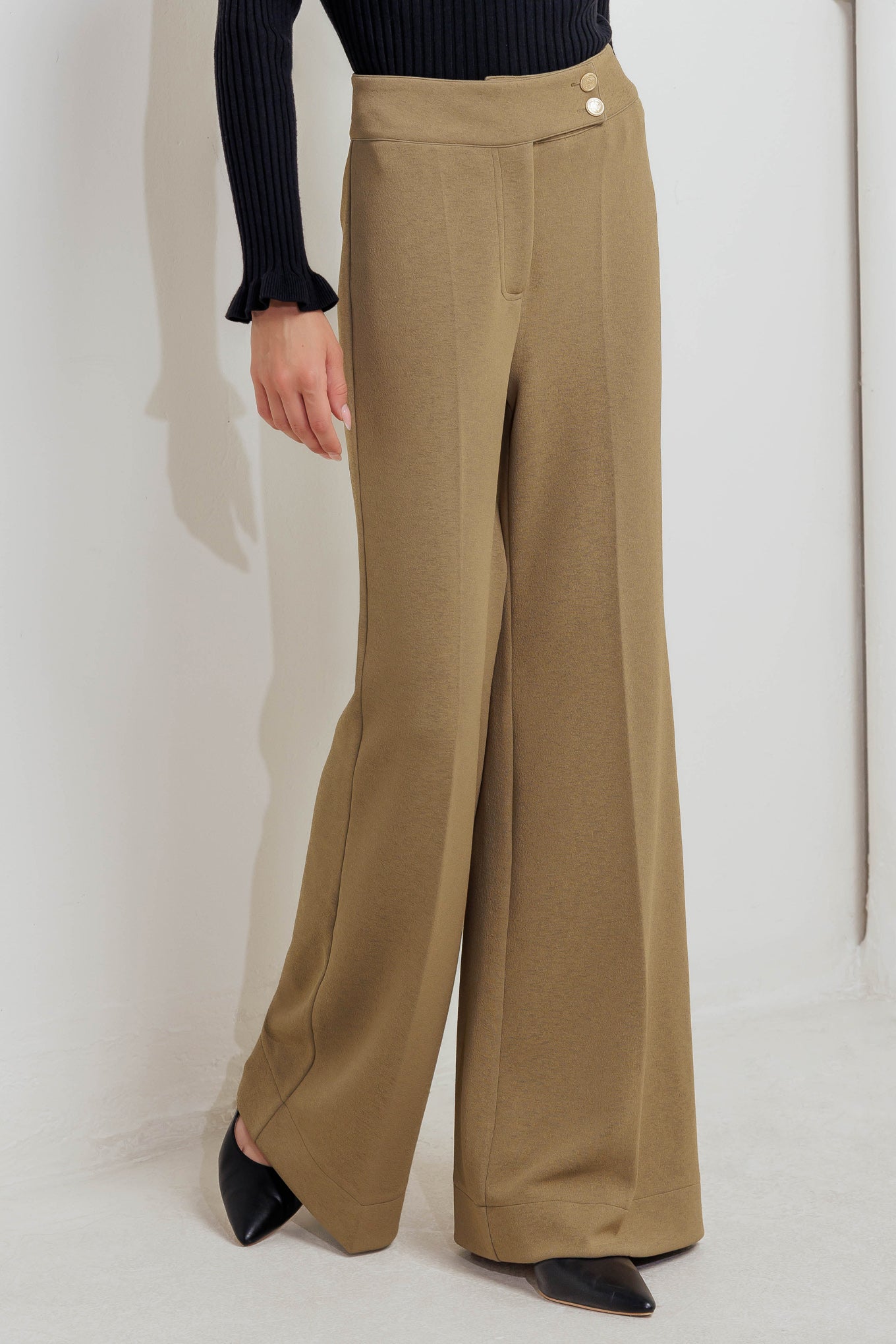 A knit pant featuring front closure and wide leg. Matching vest FJ1304