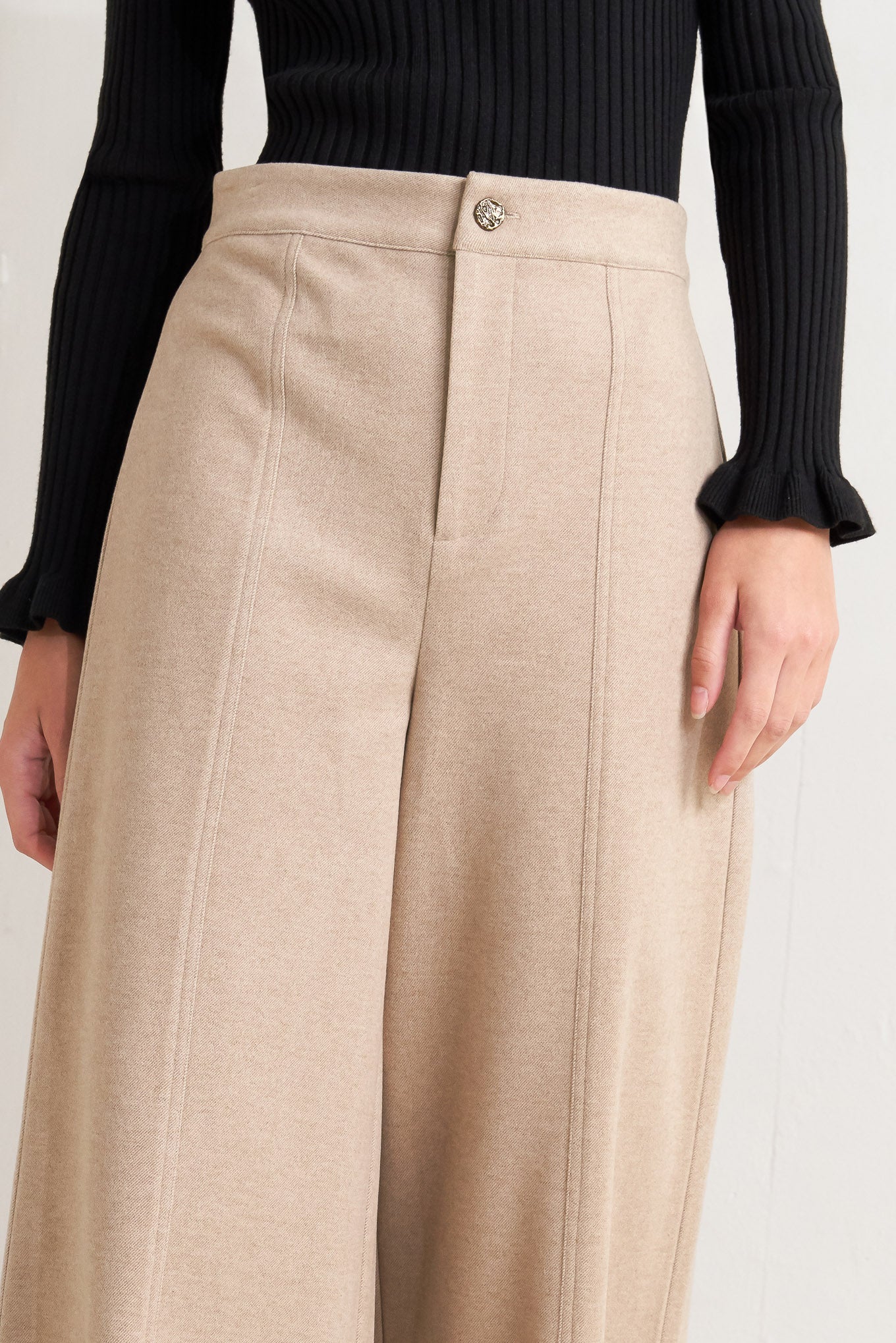 A solid knit pant with front closure and wide leg