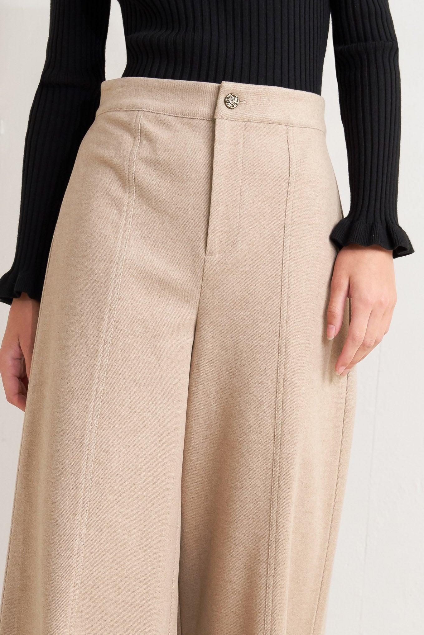 A solid knit pant with front closure and wide leg