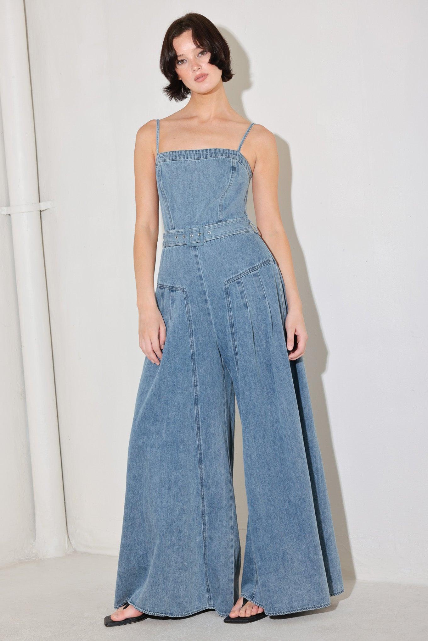 A washed denim jumpsuit featuring straight neckline, straps, self belt, extra wide leg and back zipper closure
Details:
Self : 90.2% Cotton 4.8% Viscose 5% Polyester
Size & Fit
- Model is 5`8" And Wearing Size Small
- Measurements Taken From Size Small
- Approx. Length: 60"