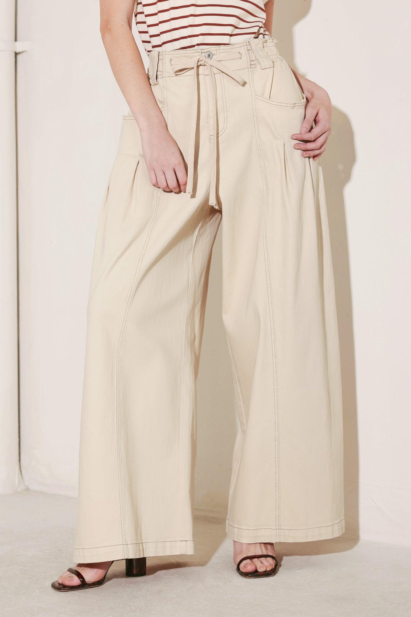 A solid woven pant featuring front closure, elastic waist with tie, pockets and wide leg. Matching vest FJ1373
Details:
Self : 97% Cotton 3% Spandex
Size & Fit
- Model is 5`8" And Wearing Size Small
- Measurements Taken From Size Small
- Approx. Length: 42"