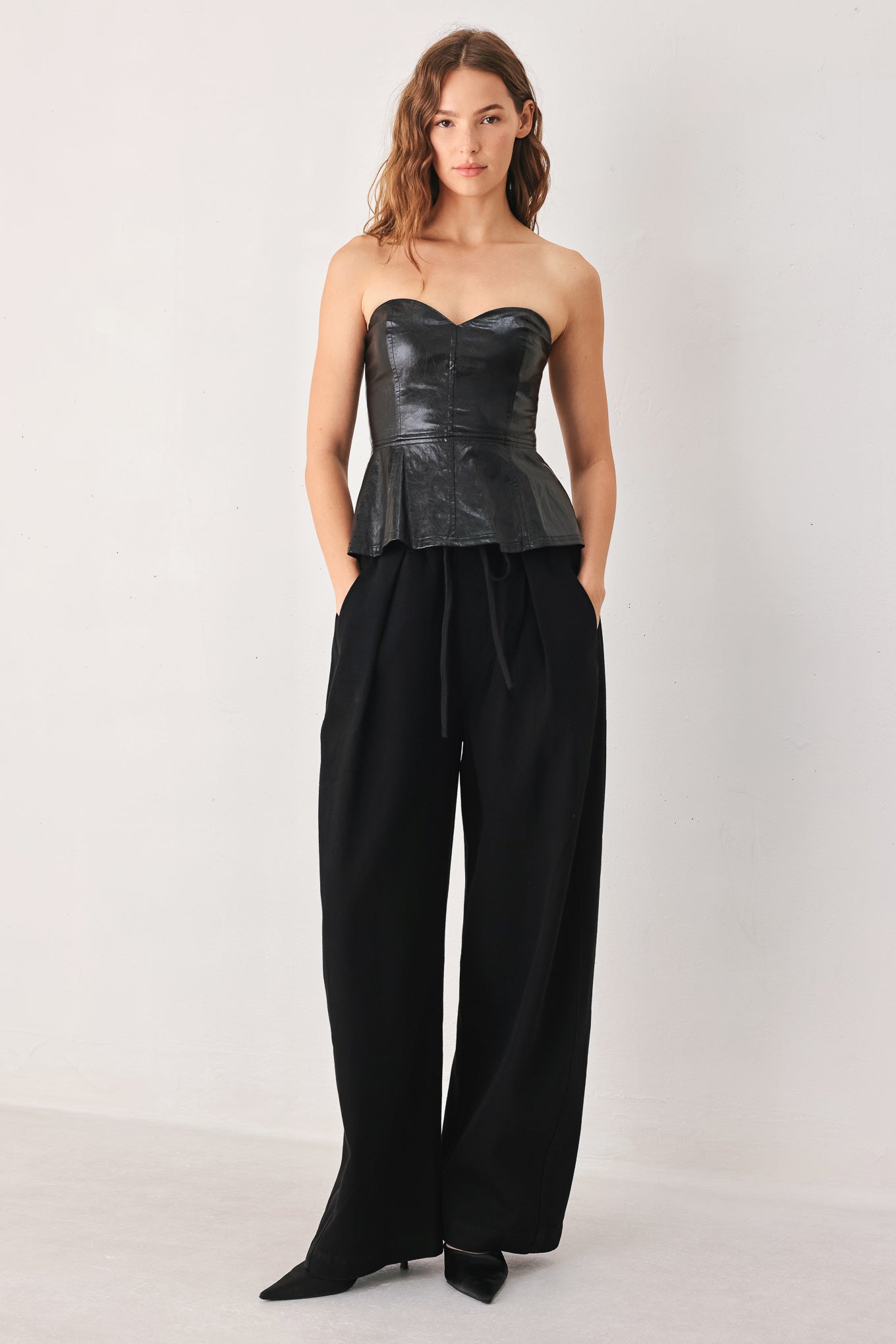 Woman wearing black wide-leg drawstring pants | FREEMARKET