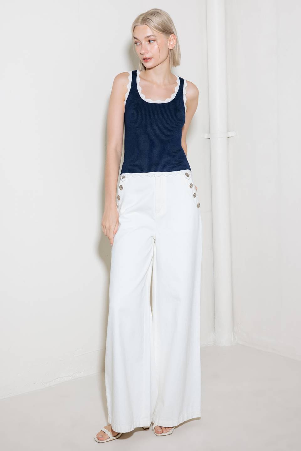 A sweater knit tank top with contrasting trimmed edge.