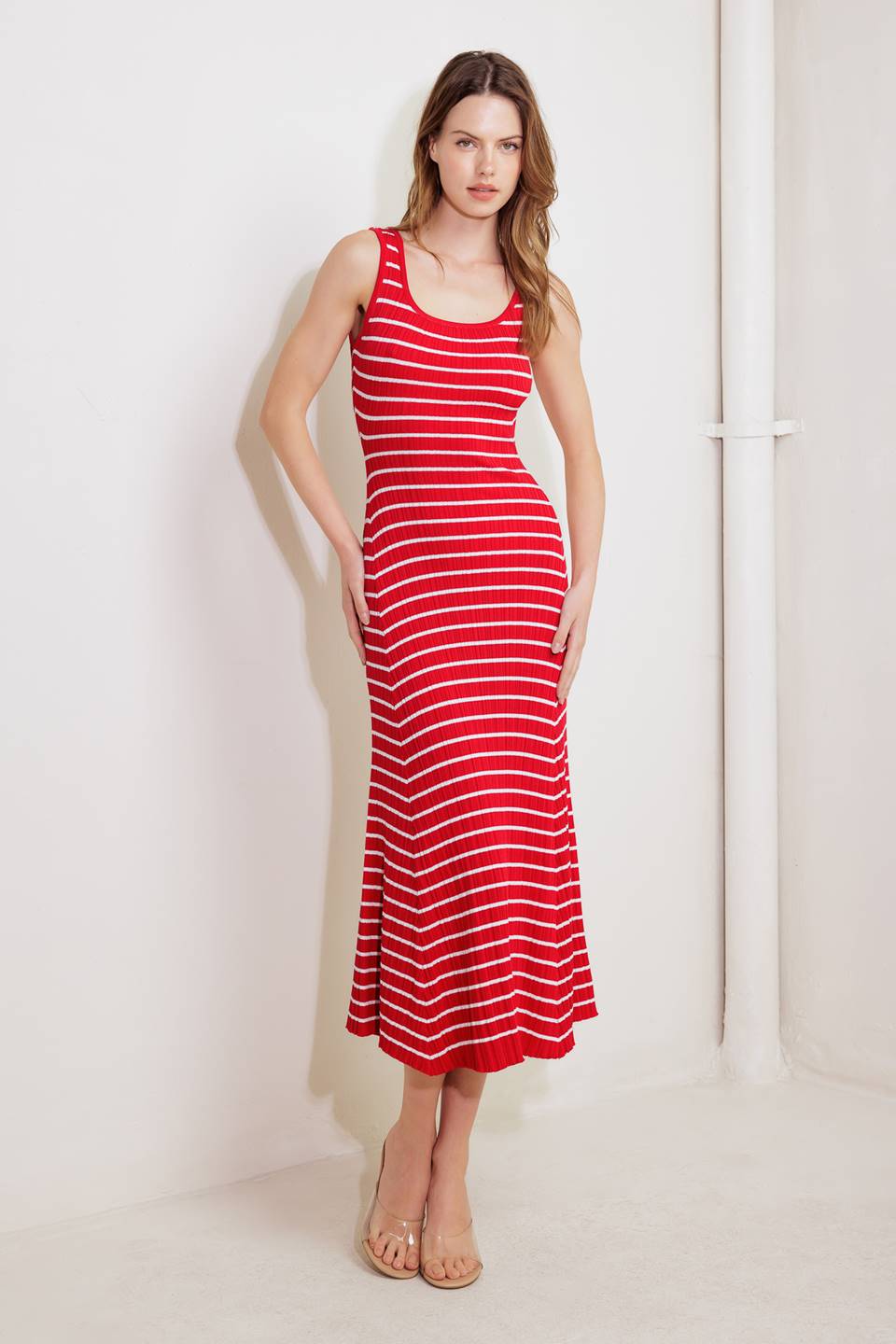 A striped sweater knit midi dress featuring square neckline and sleeveless